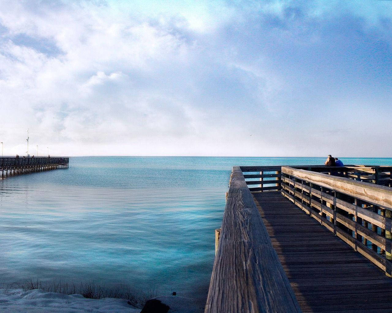 Bridge On Quiet Ocean Background