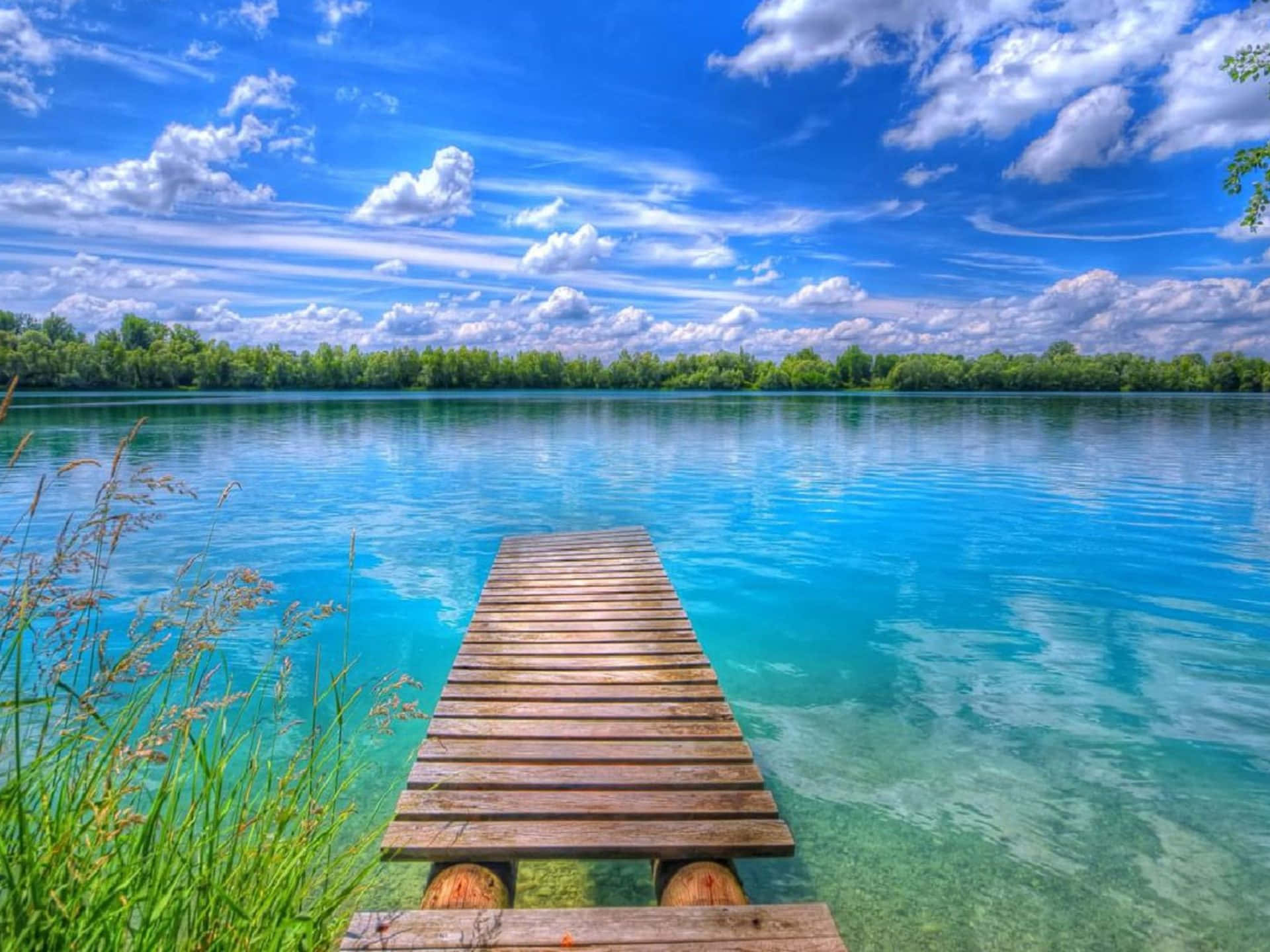 Bridge Over Magnificent Lake Background