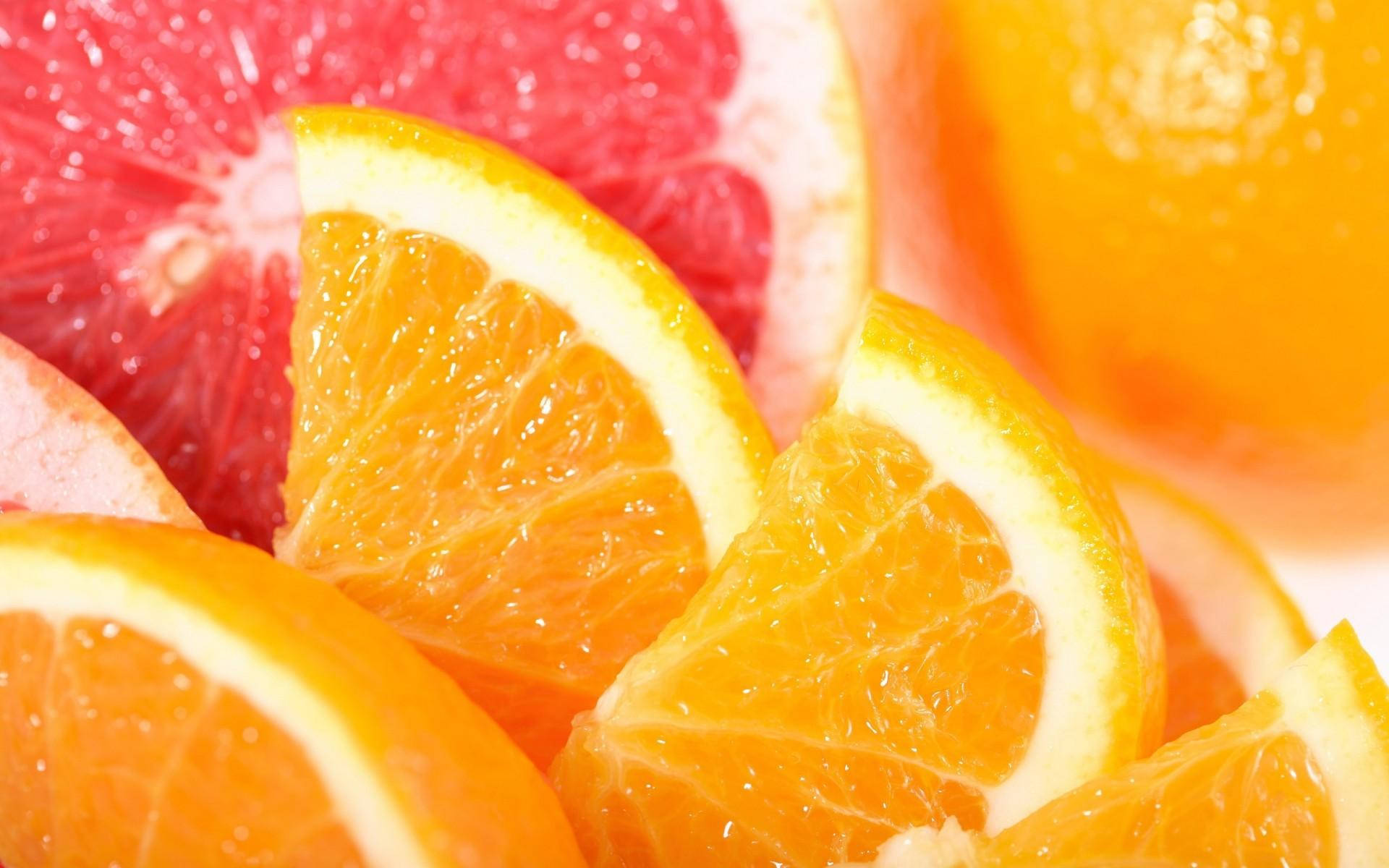 Bright And Fresh Sliced Citrus Fruits - Grapefruits And Oranges Background