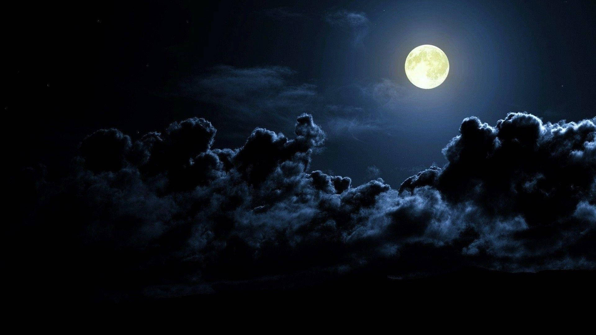 Bright Beautiful Moon And Dark Clouds Background