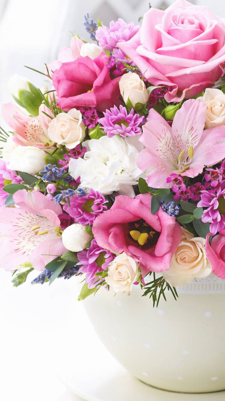 Bright Blooms In Polka Dotted Vase Background