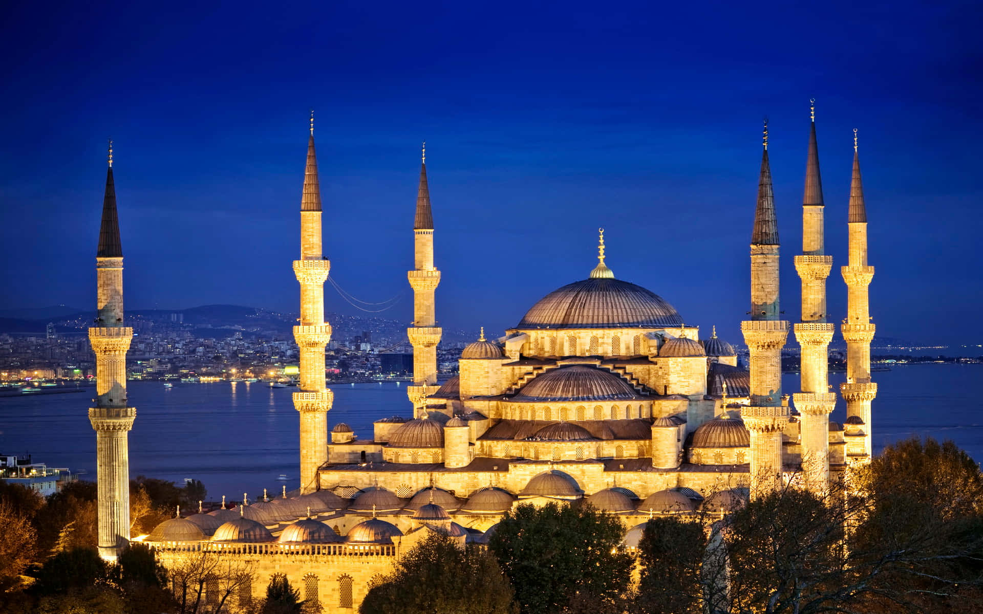 Bright Blue Mosque In Night Sky Background