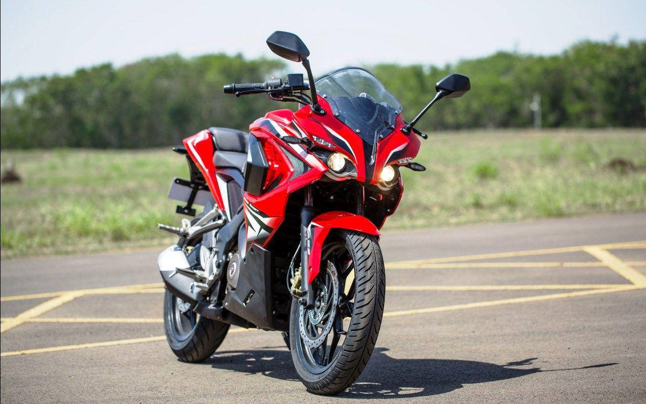 Bright Red Pulsar Rs200 Motorcycle In High Definition Background