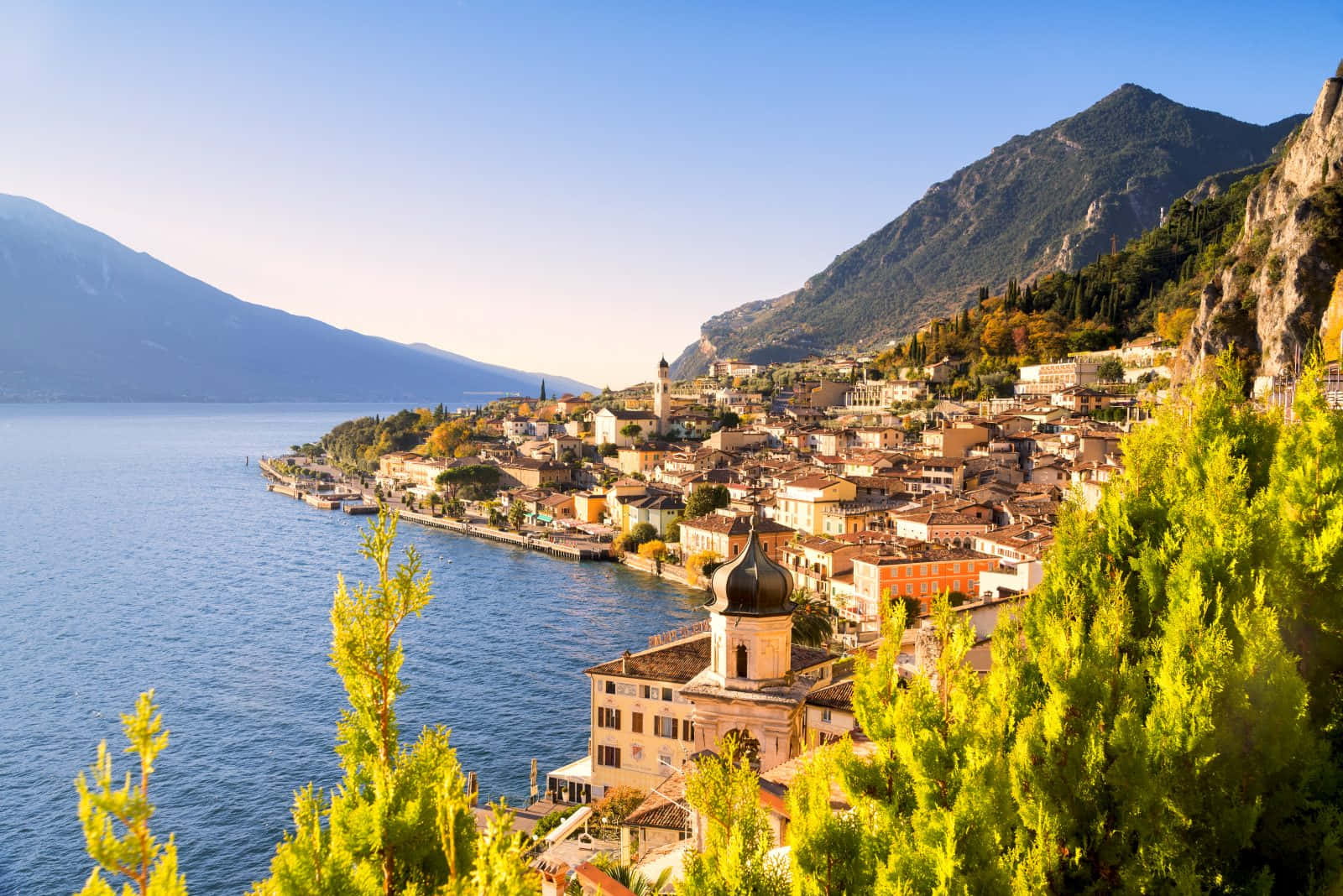 Bright Sunset In Lago Di Garda Background