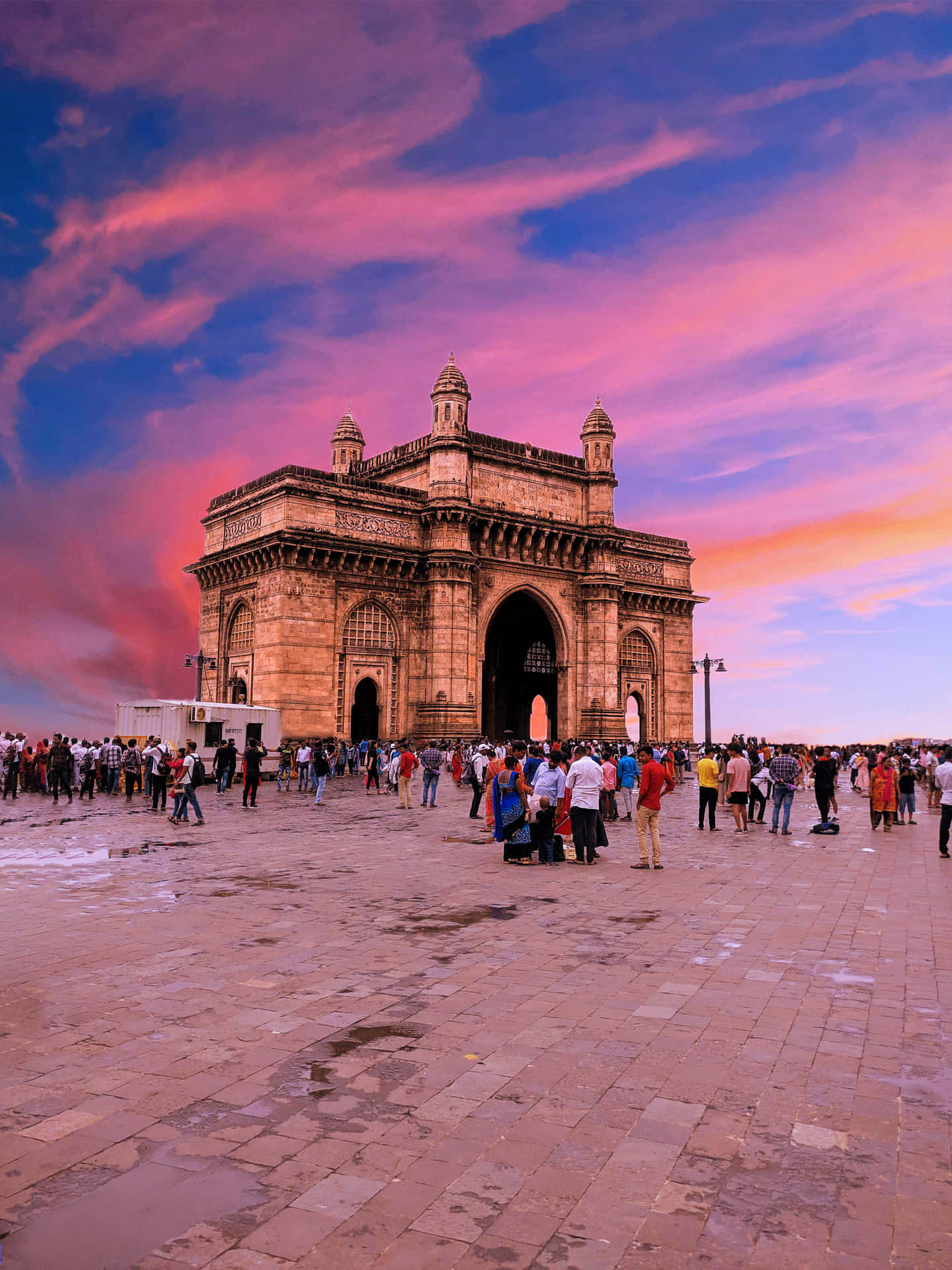 Bright Sunset Over Gateway To India Background