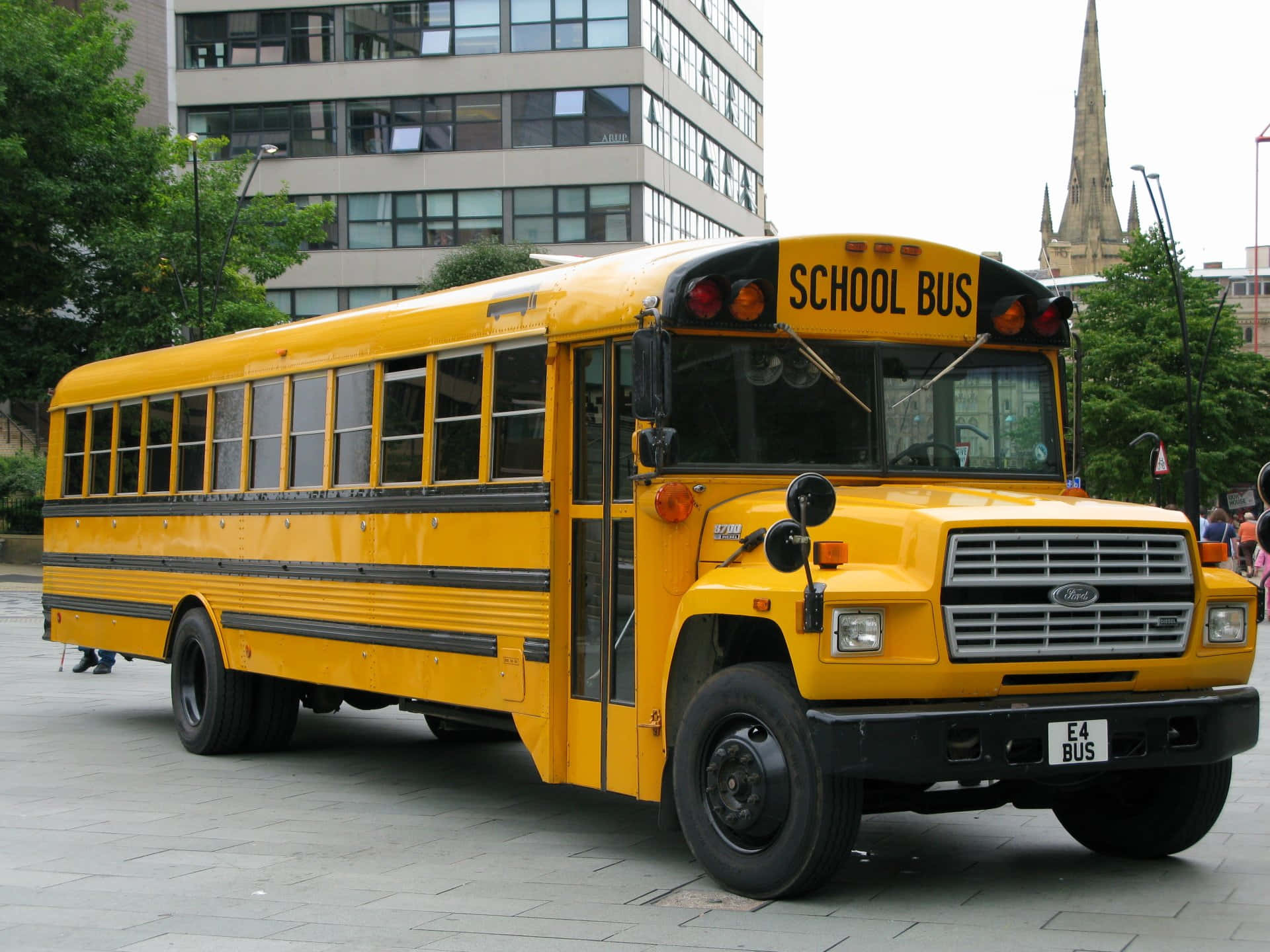 Bright Yellow School Bus Parked In A Campus