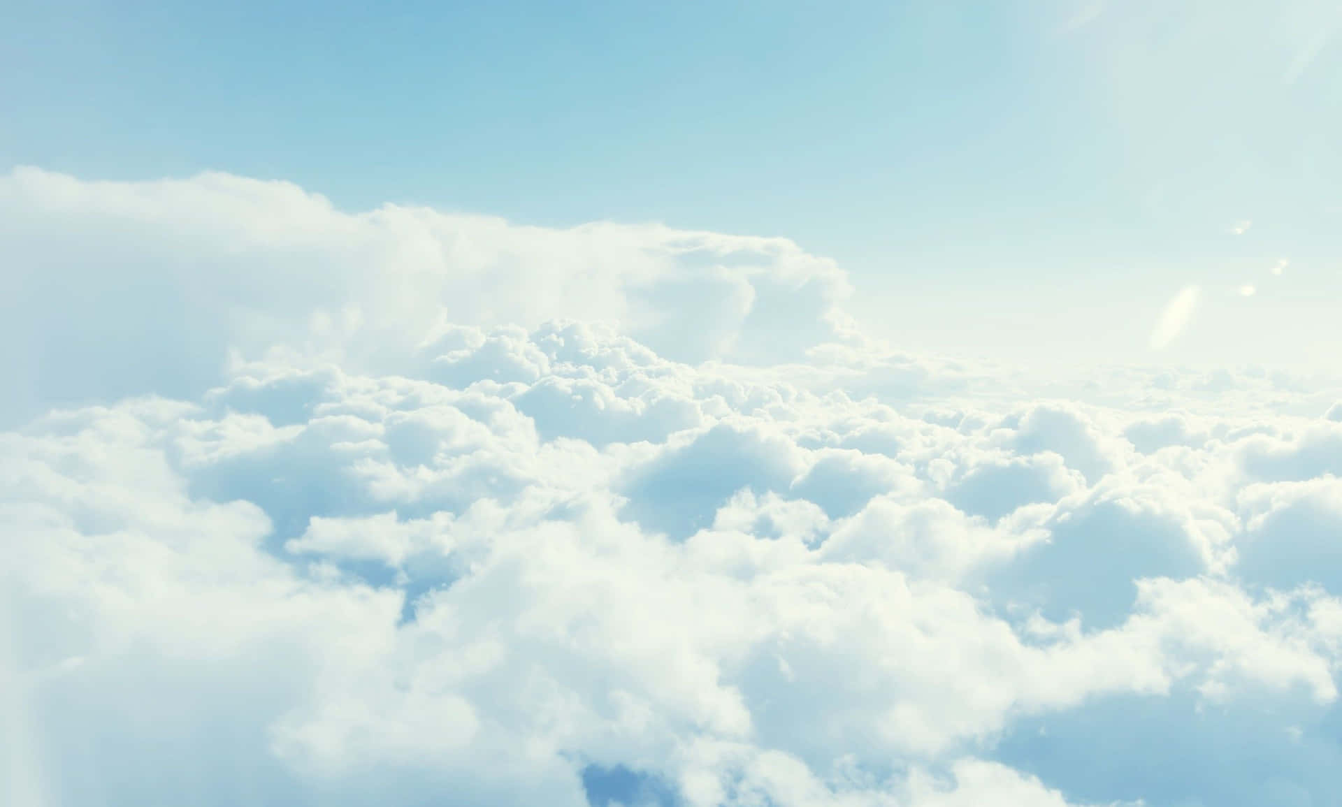 Brighten Up Your Workspace With A Light Blue Laptop Background