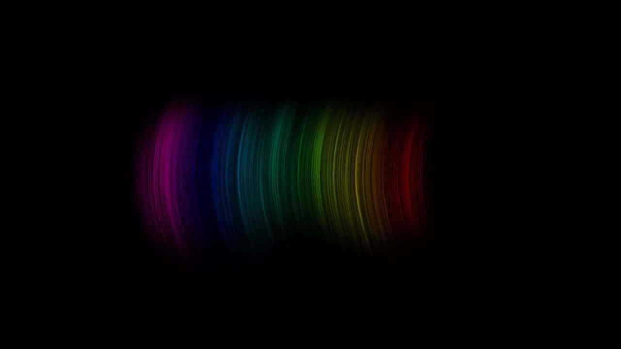 Brightly Colored Rainbow Cutting Through A Pitch Black Sky. Background