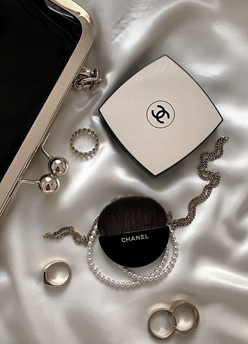 Bring Sophisticated Elegance To Your Space With This Luxury Chanel Aesthetic Wallpaper. Background