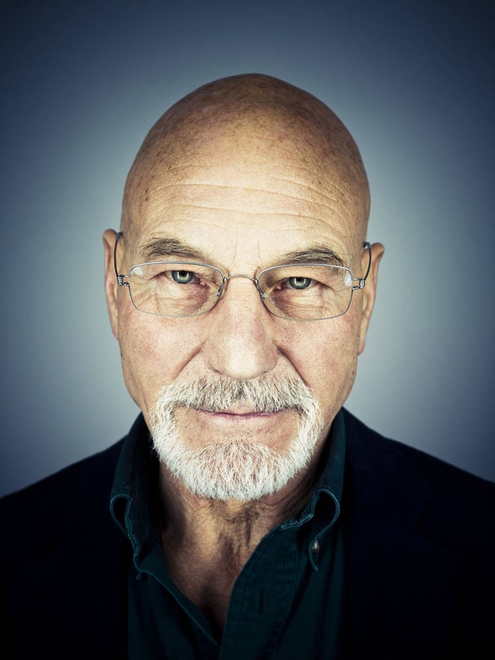 British Actor Patrick Stewart Donning Transparent Eyeglasses Background