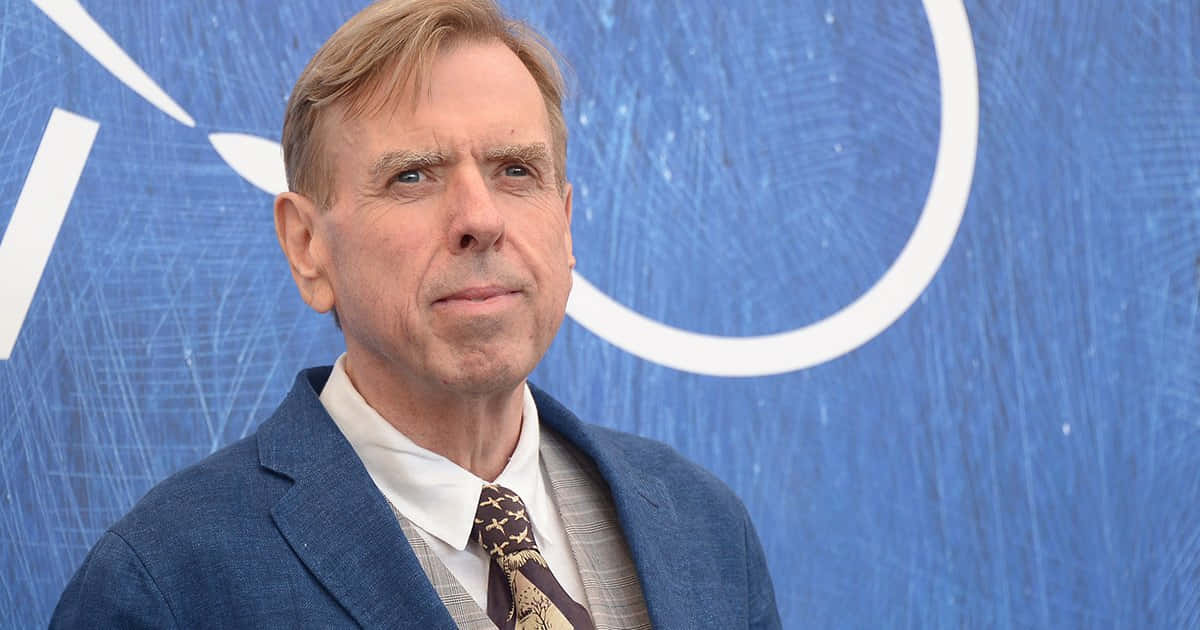 British Actor Timothy Spall Smiling For A Photoshoot Background