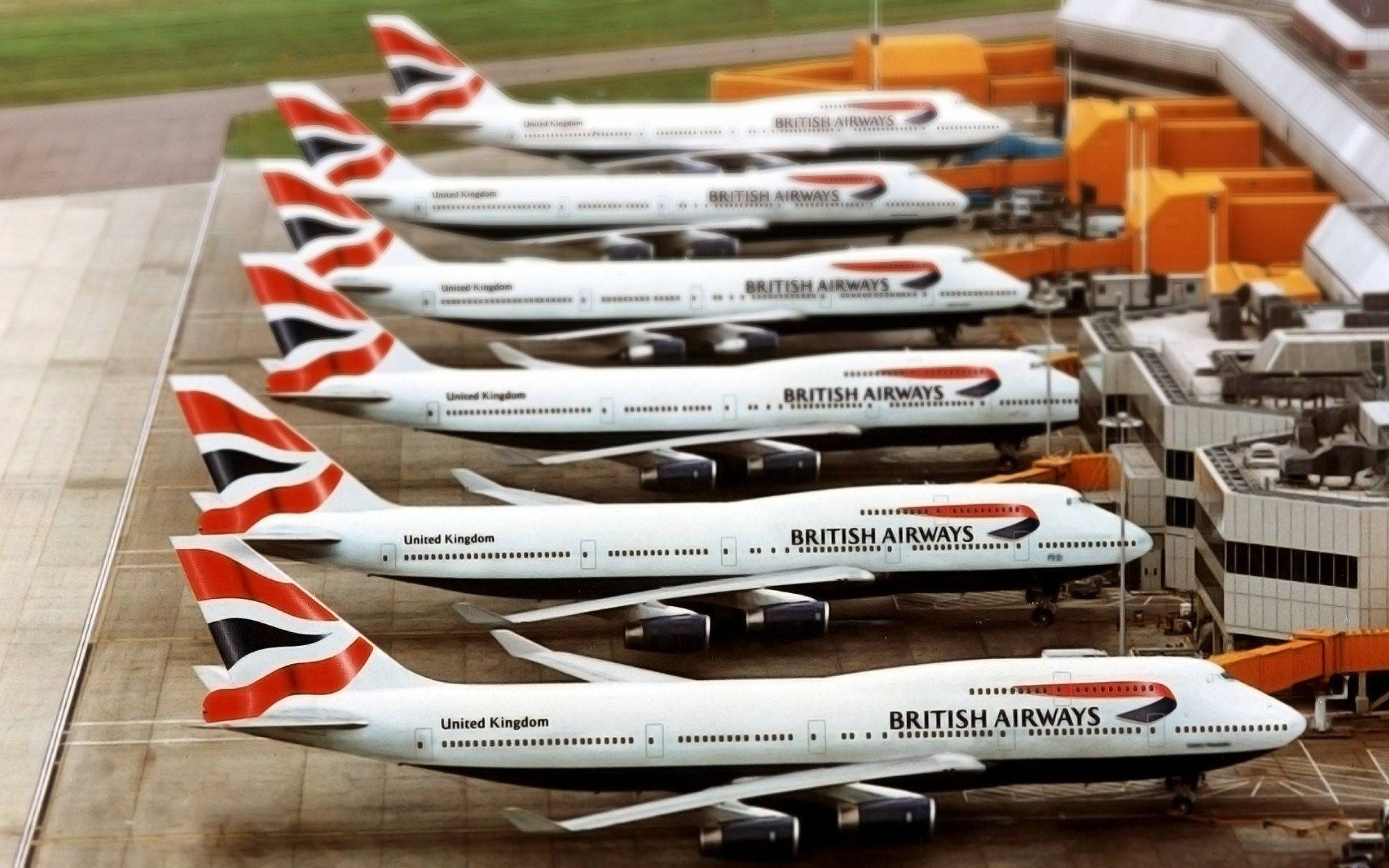 British Airways' Boeing Fleet Resting At The Airport Background