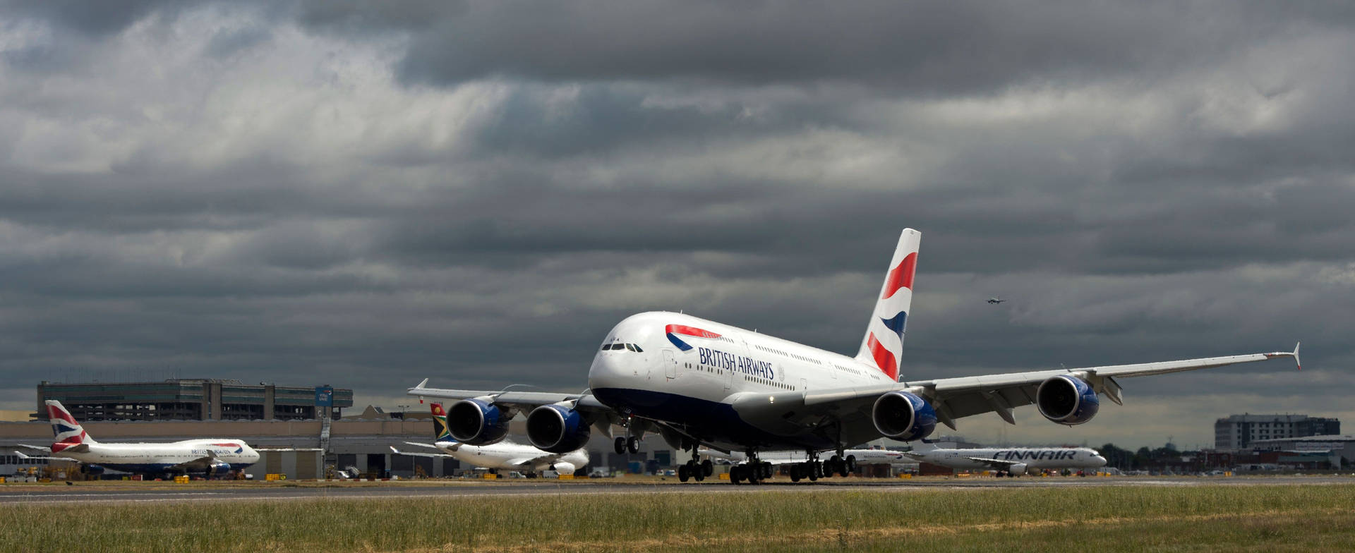 British Airways Runway With Dark Clouds Background