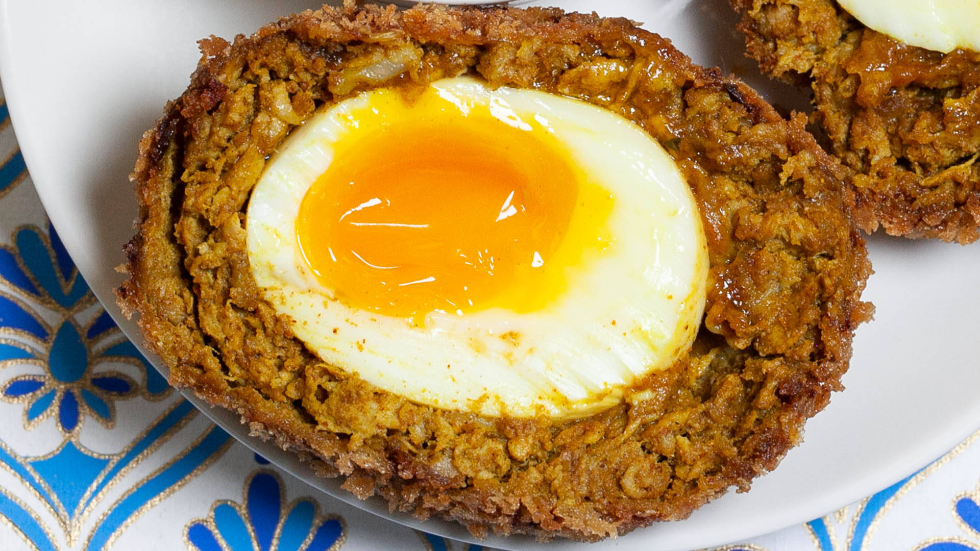 British Scotch Egg Dish With Runny Yolk Center Background