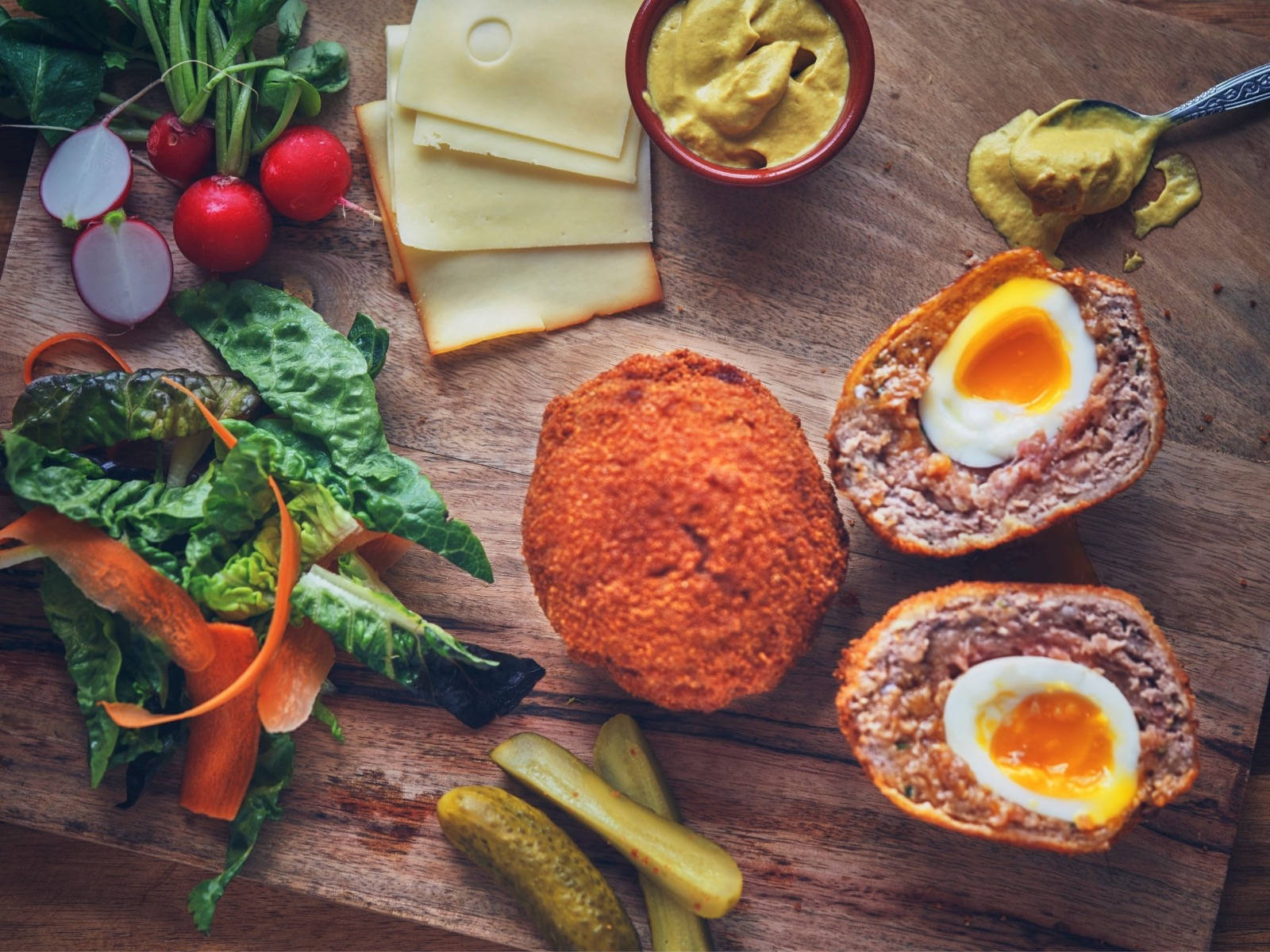 British Scotch Eggs Dish With Cheese And Vegetables Background