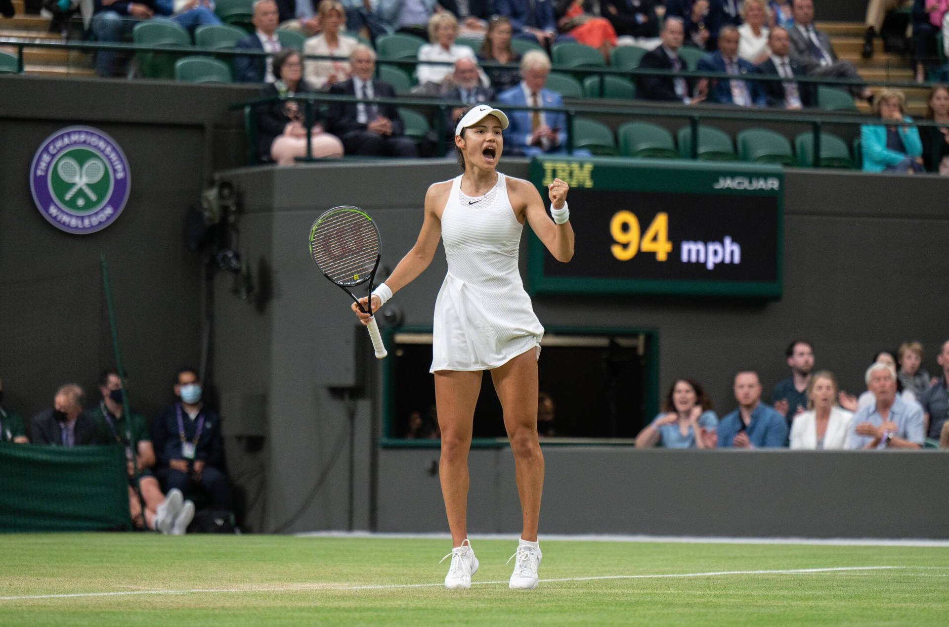 British Tennis Sensation Emma Raducanu Mid-stretch Background