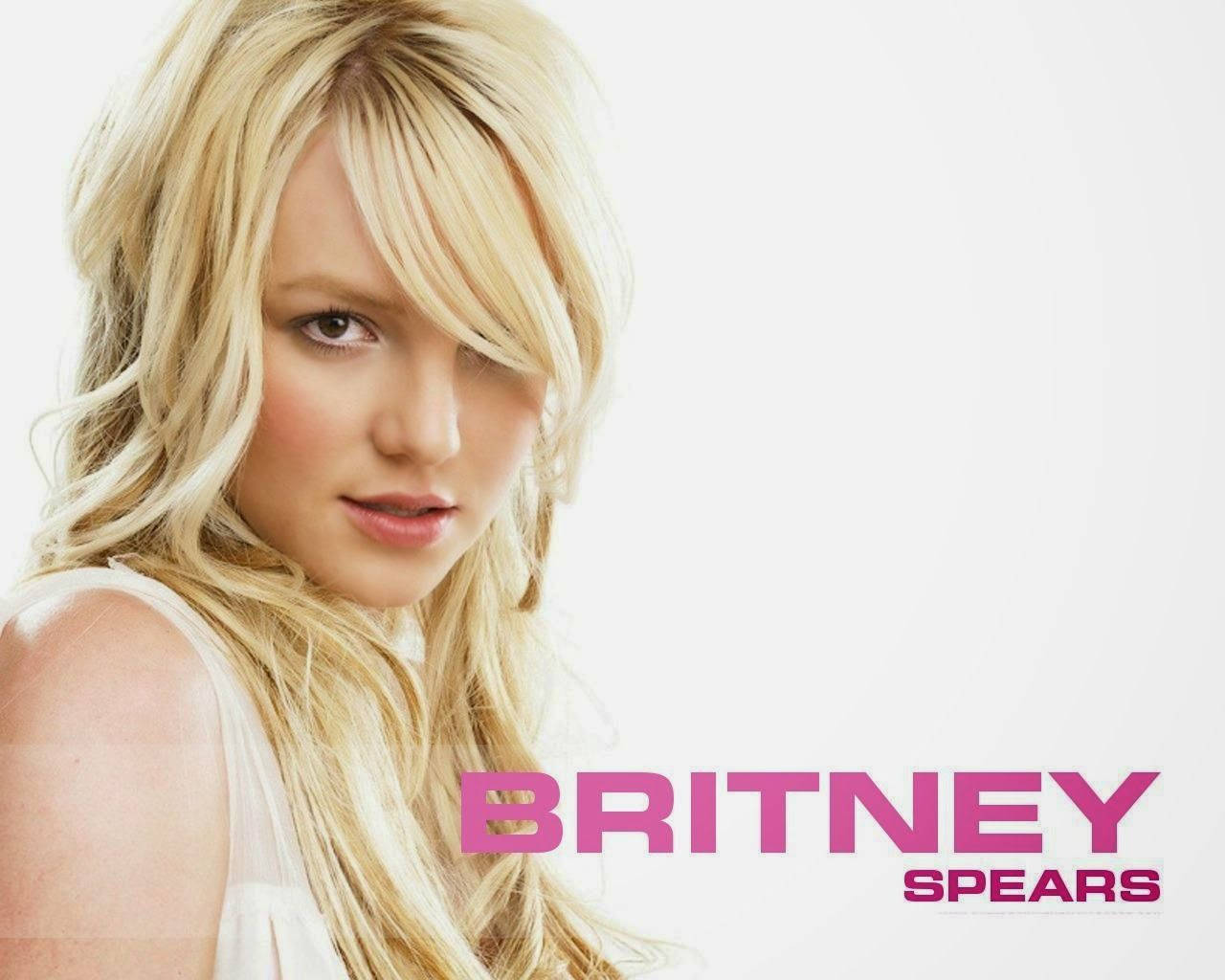 Britney Spears Having Fun In Pink And White Background
