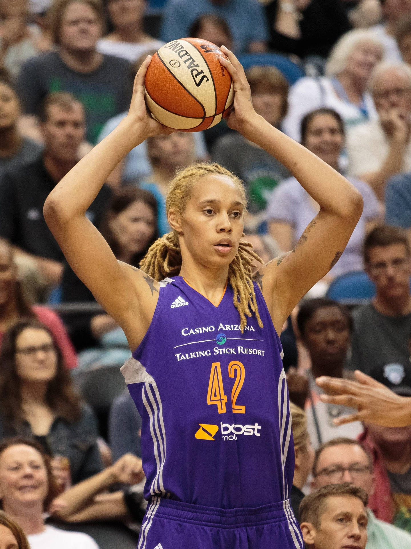 Brittney Griner Holding Ball Up Background