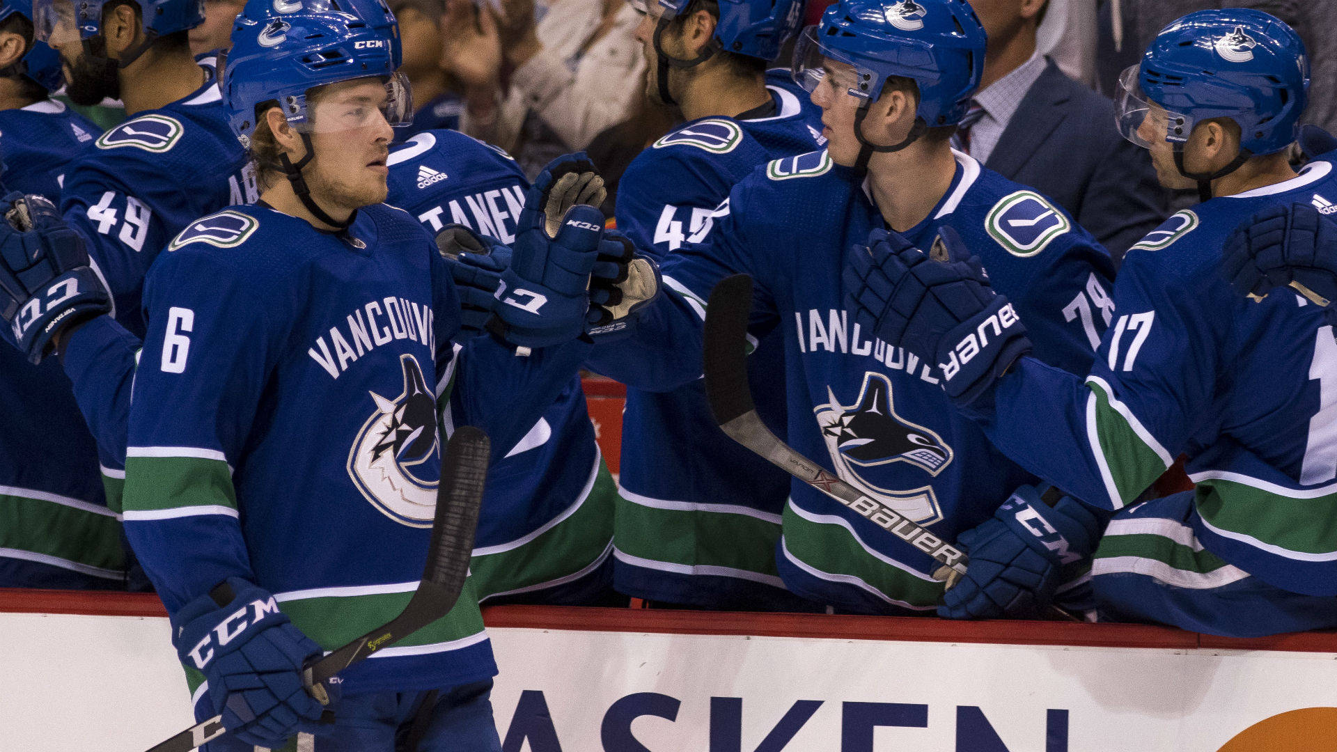 Brock Boeser Celebrate Goal Teammates Background