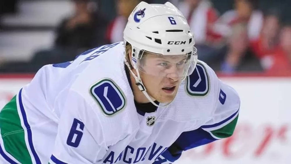 Brock Boeser In Action Against Calgary Flames Background