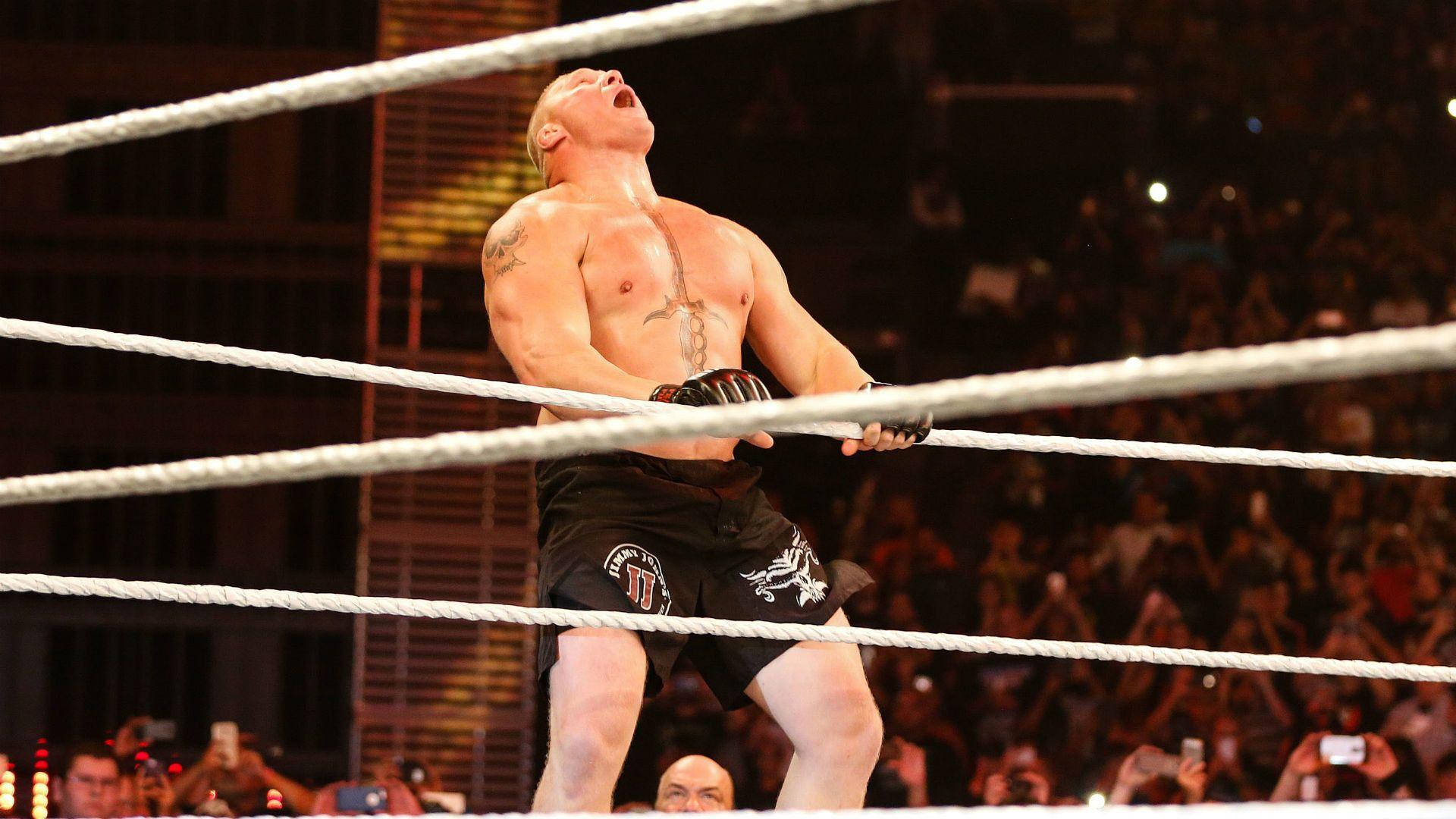 Brock Lesnar Dominating The Ring In Full Action Background