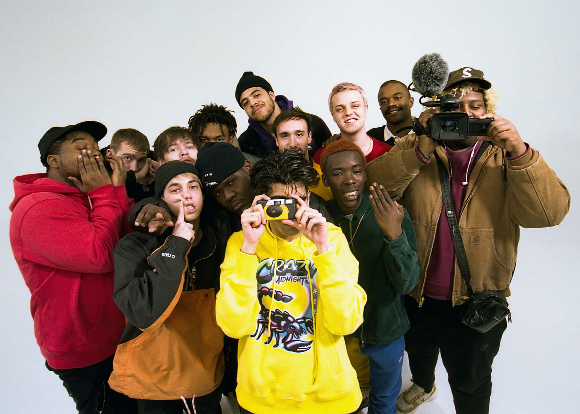 Brockhampton Poses Together In Creative Outfits Background