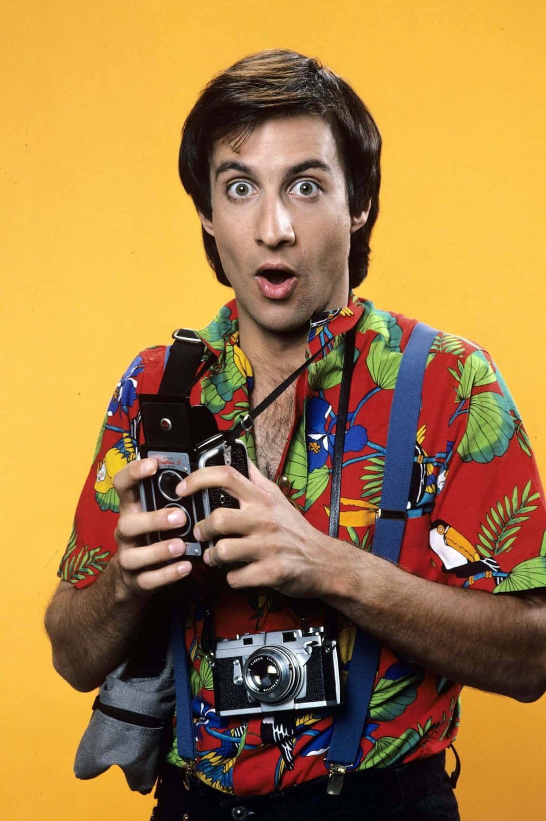 Bronson Pinchot Posing With A Smile Background