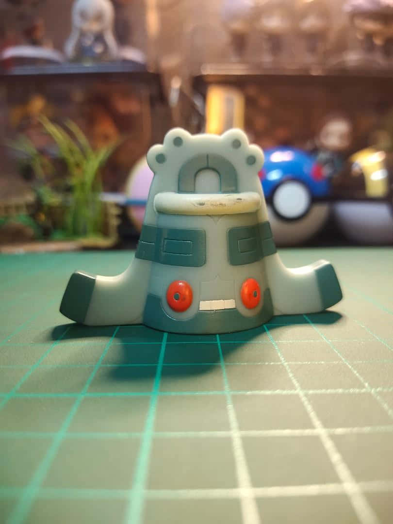 Bronzong Figure Close Up Background