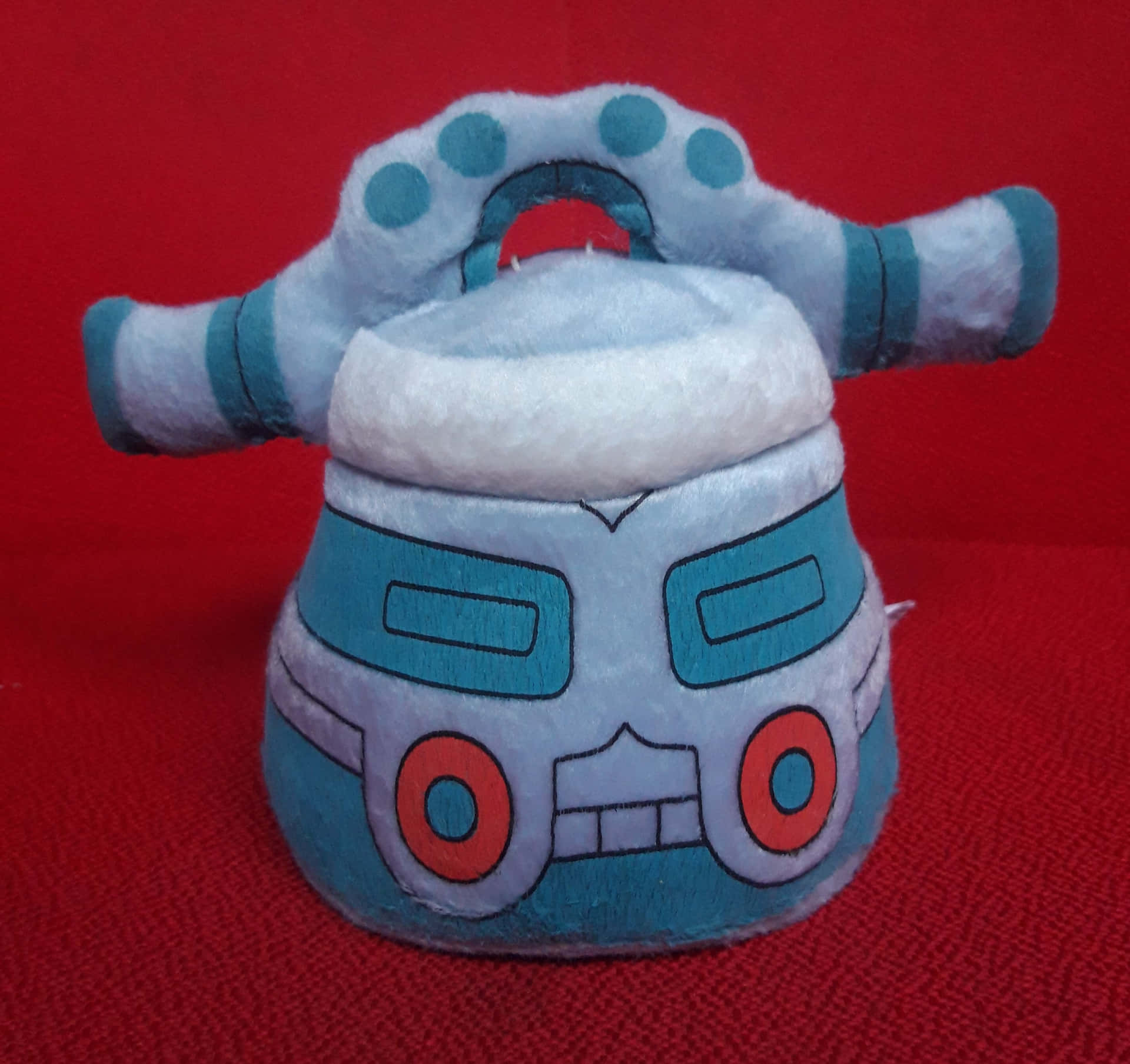 Bronzong Plush Toy On Red Background Background
