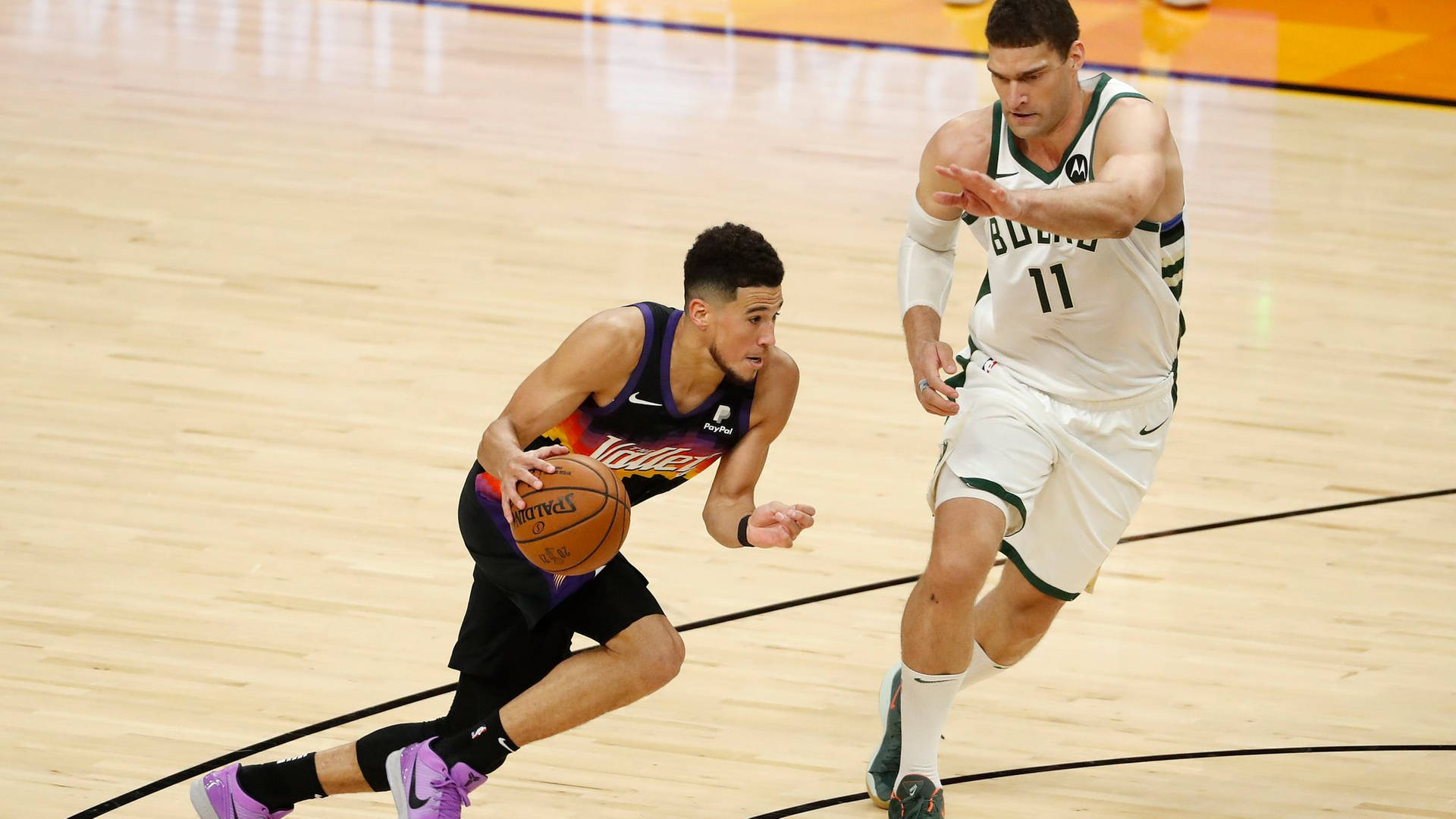 Brook Lopez Against Devin Booker Background