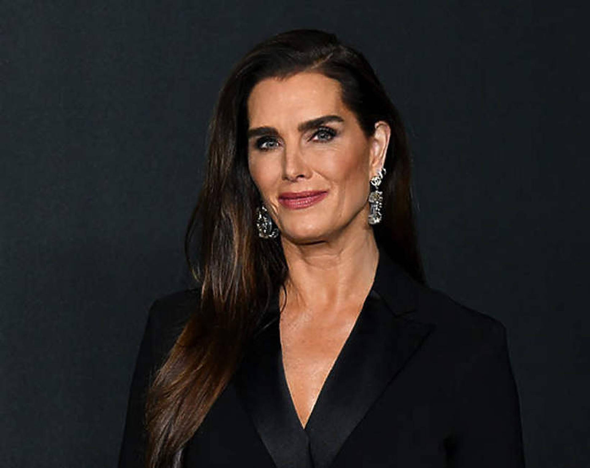 Brooke Shields In Black Outfit Background