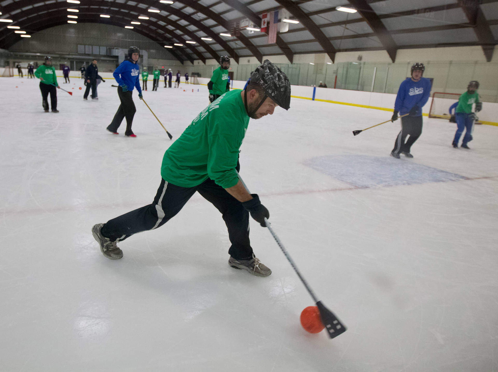 Broomball Green And Blue Sports Players Background