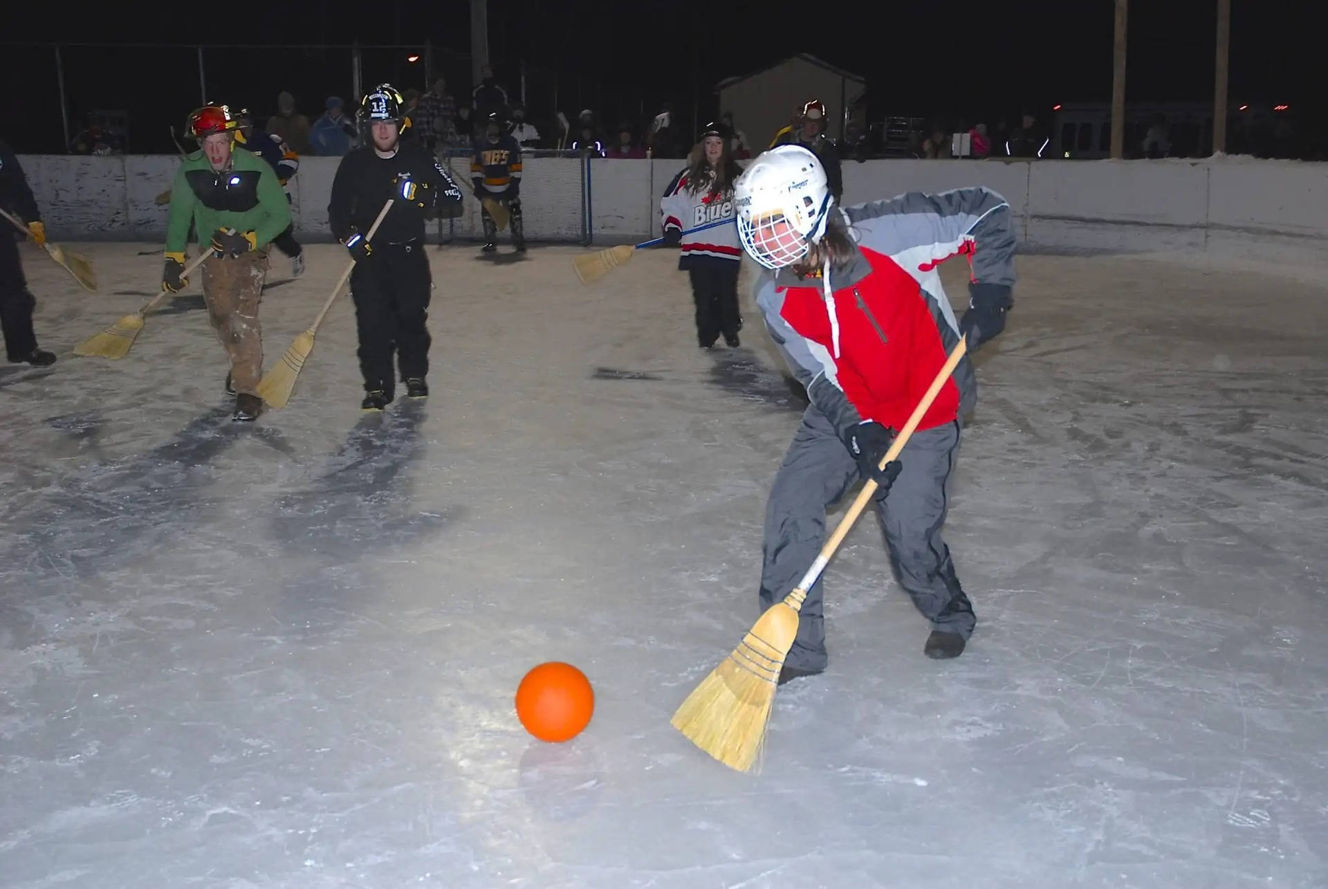 Broomball Players At Night Background