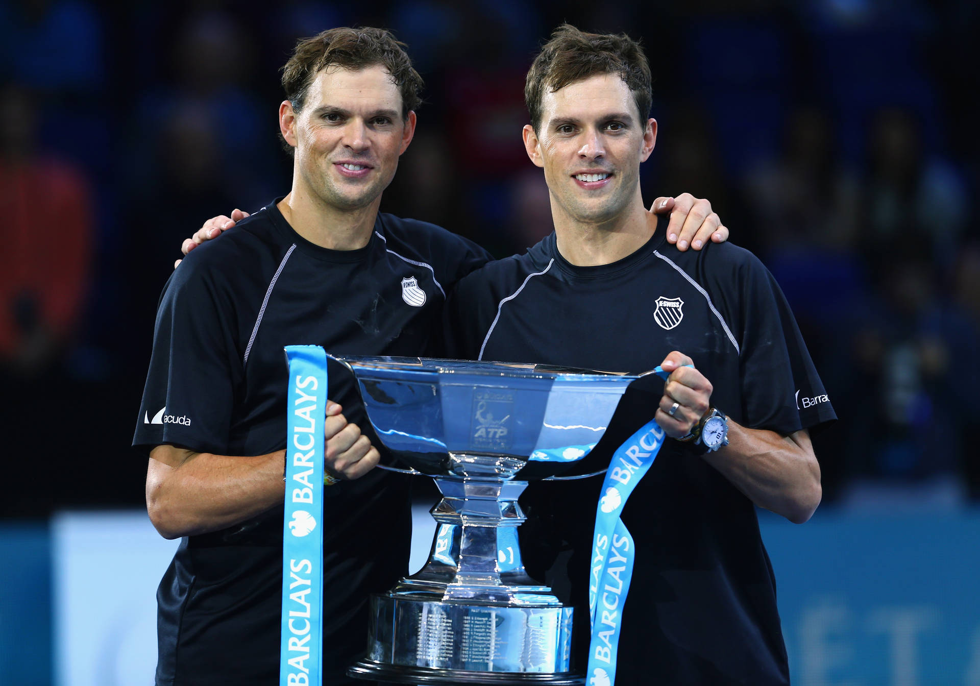 Brothers Bob And Mike Bryan Holding Winning Tennis Trophy