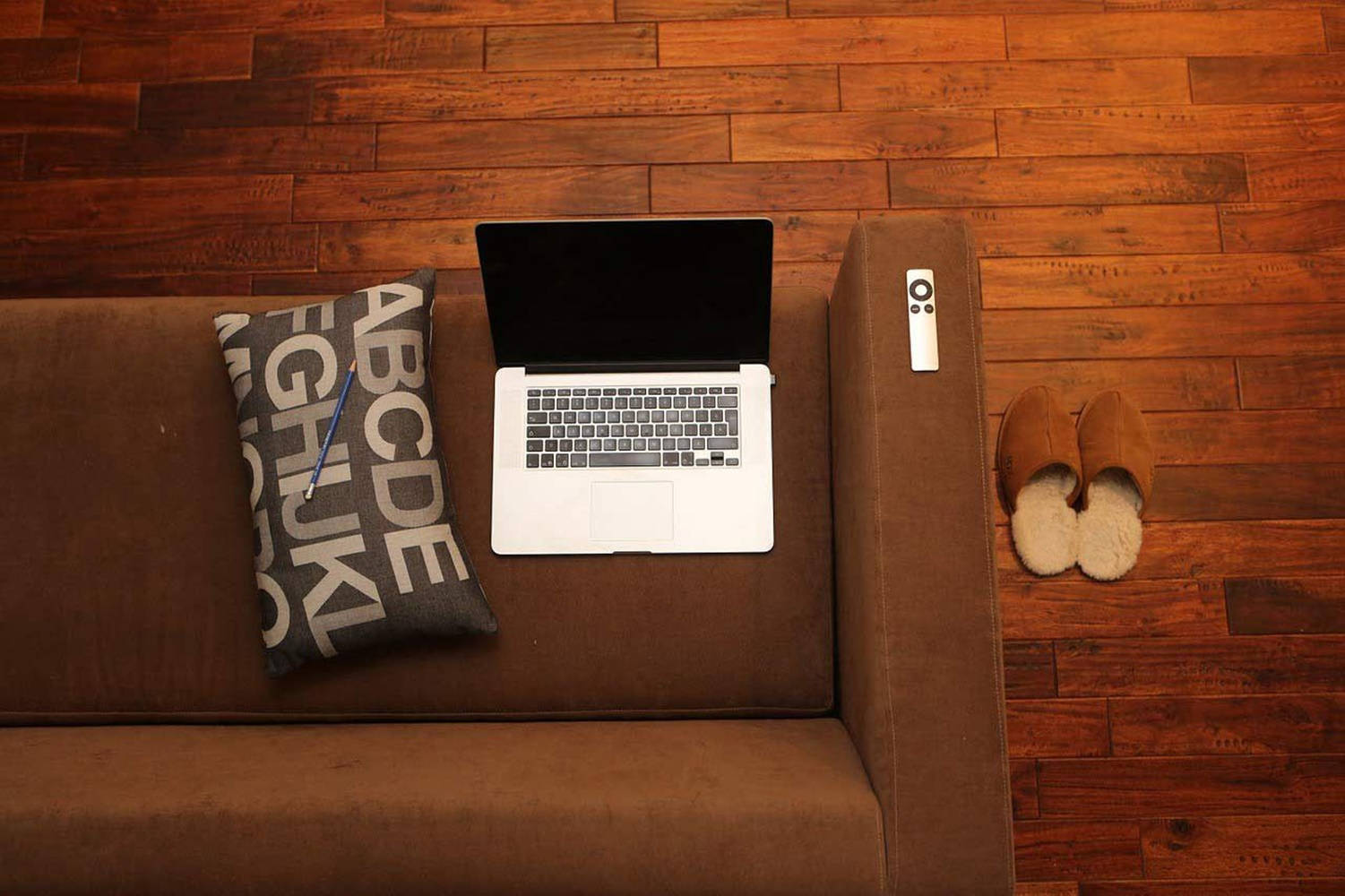 Brown Aesthetic Couch With Laptop Background