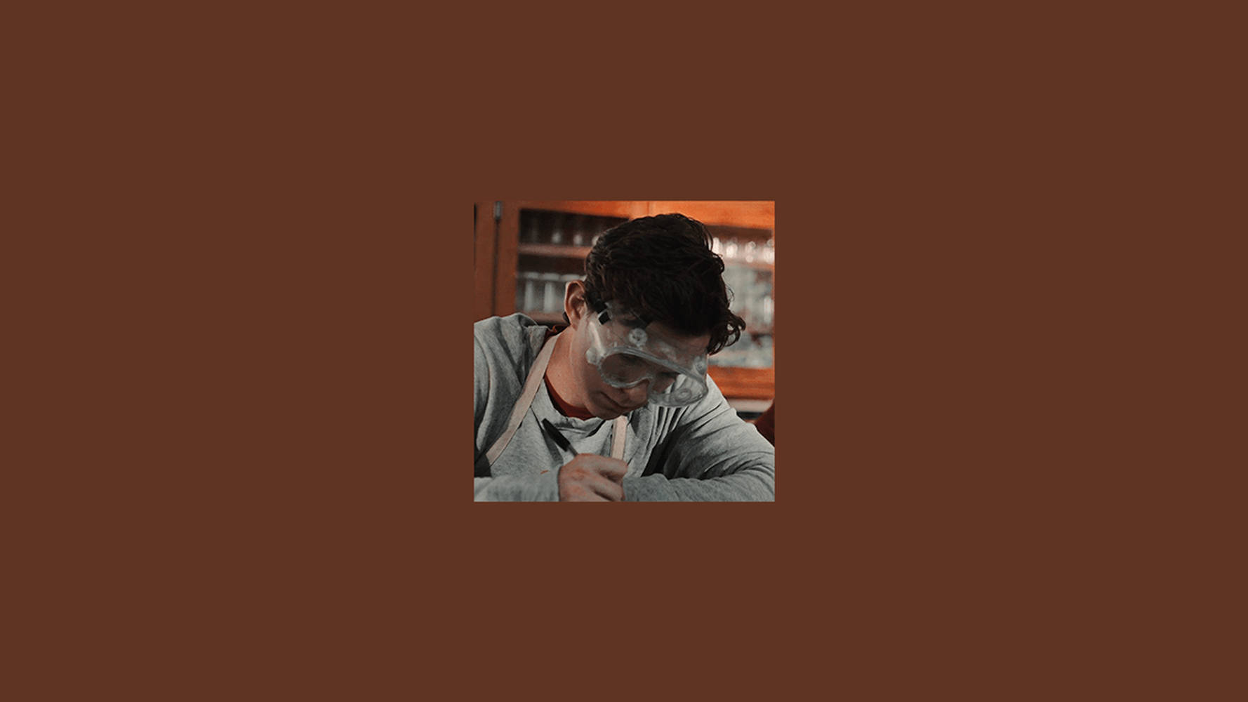 Brown Aesthetic Man With Goggles Laptop Background