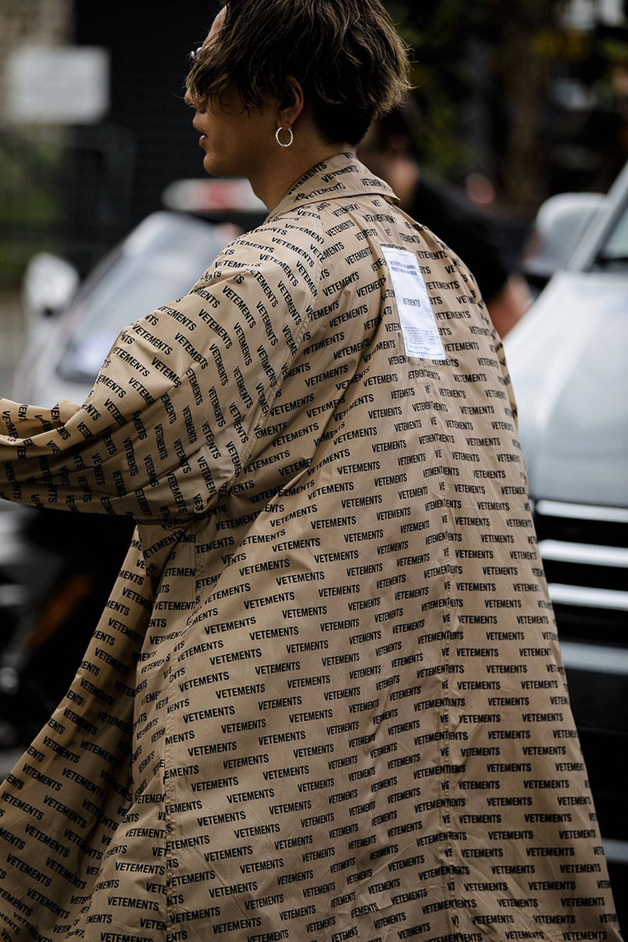 Brown Coat With Vetements Pattern Background