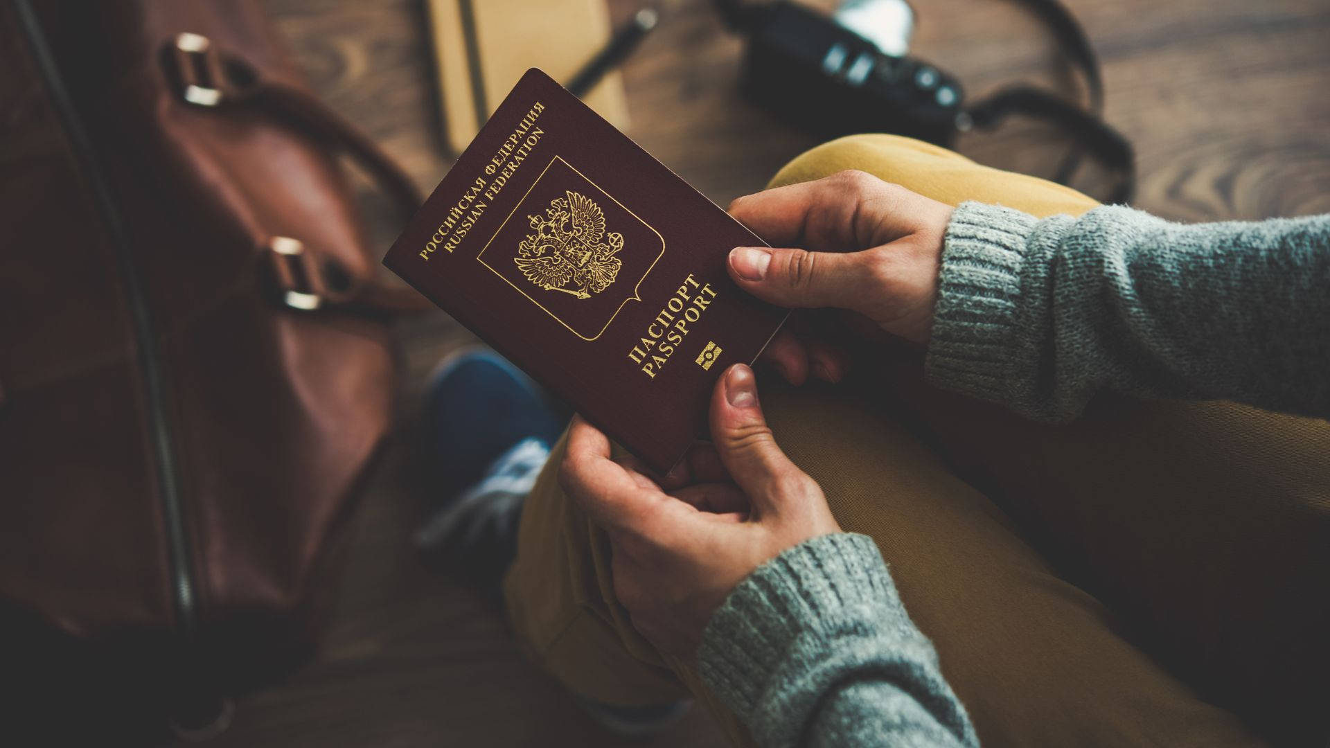 Brown Leather Bag And Russian Passport Background