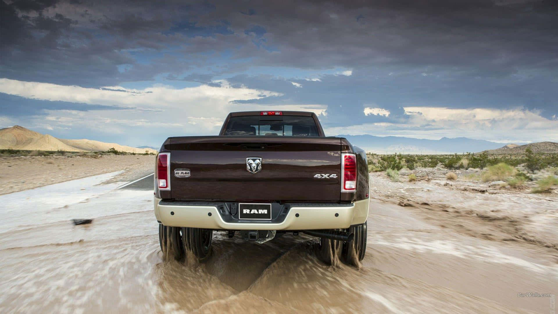 Brown Lifted Truck On Muddy Area Background