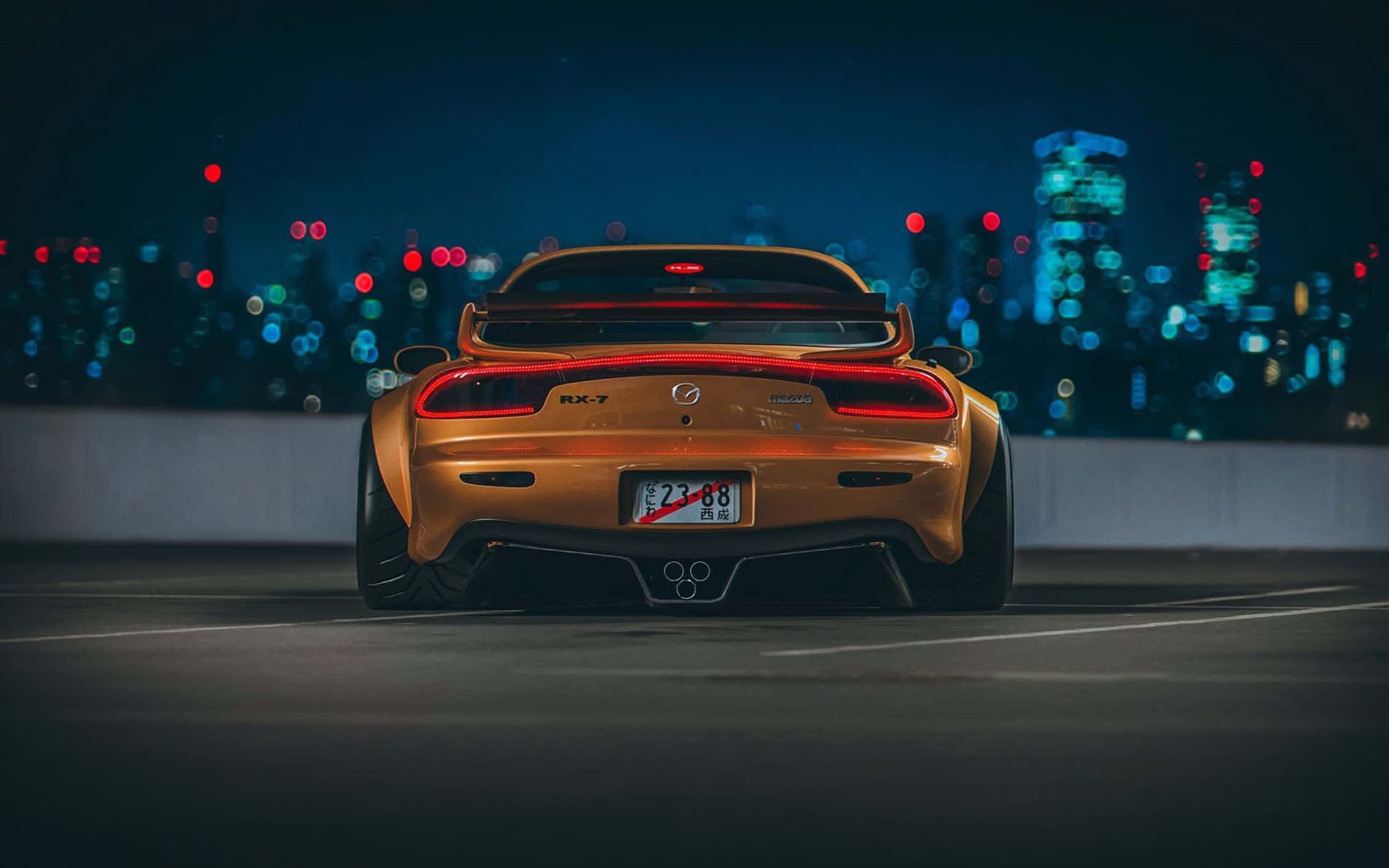 Brown Mazda Rx 7 With Cityscape Background