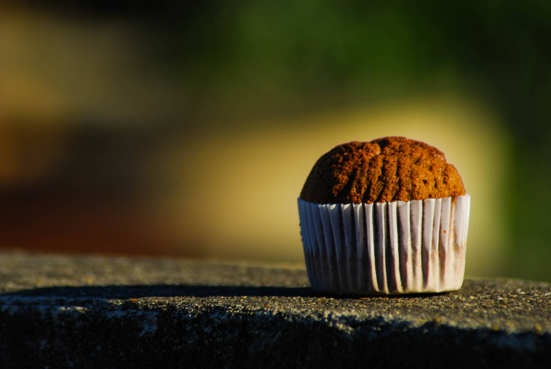 Brown Muffin In Blurry Background Background