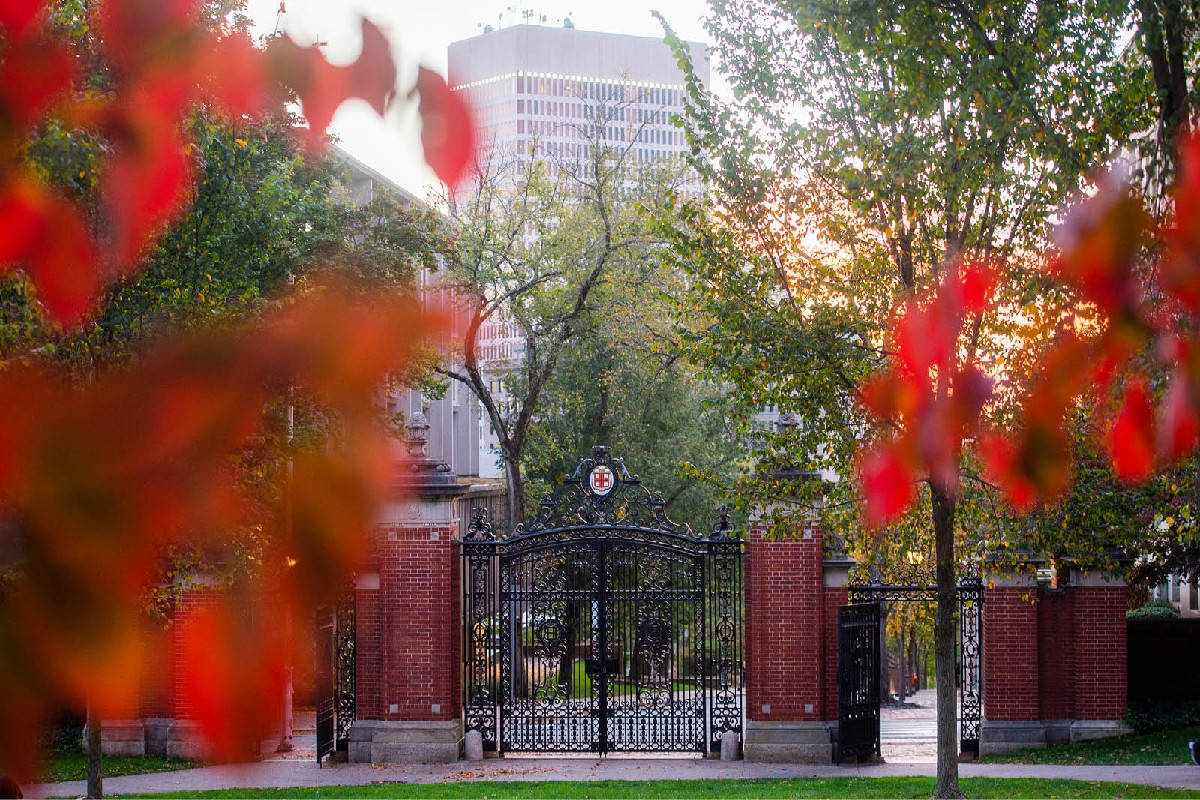 Brown University Gates With Red Blurry Leaves