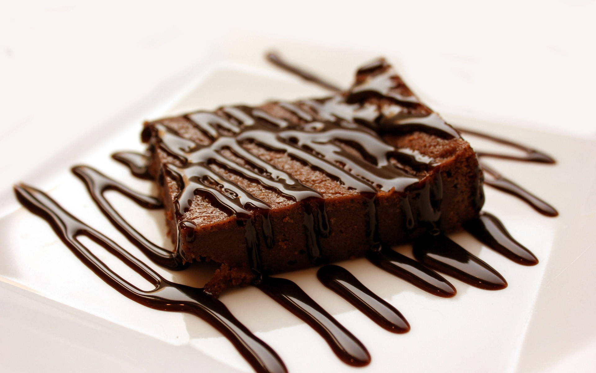 Brownie With Chocolate Drizzle Background