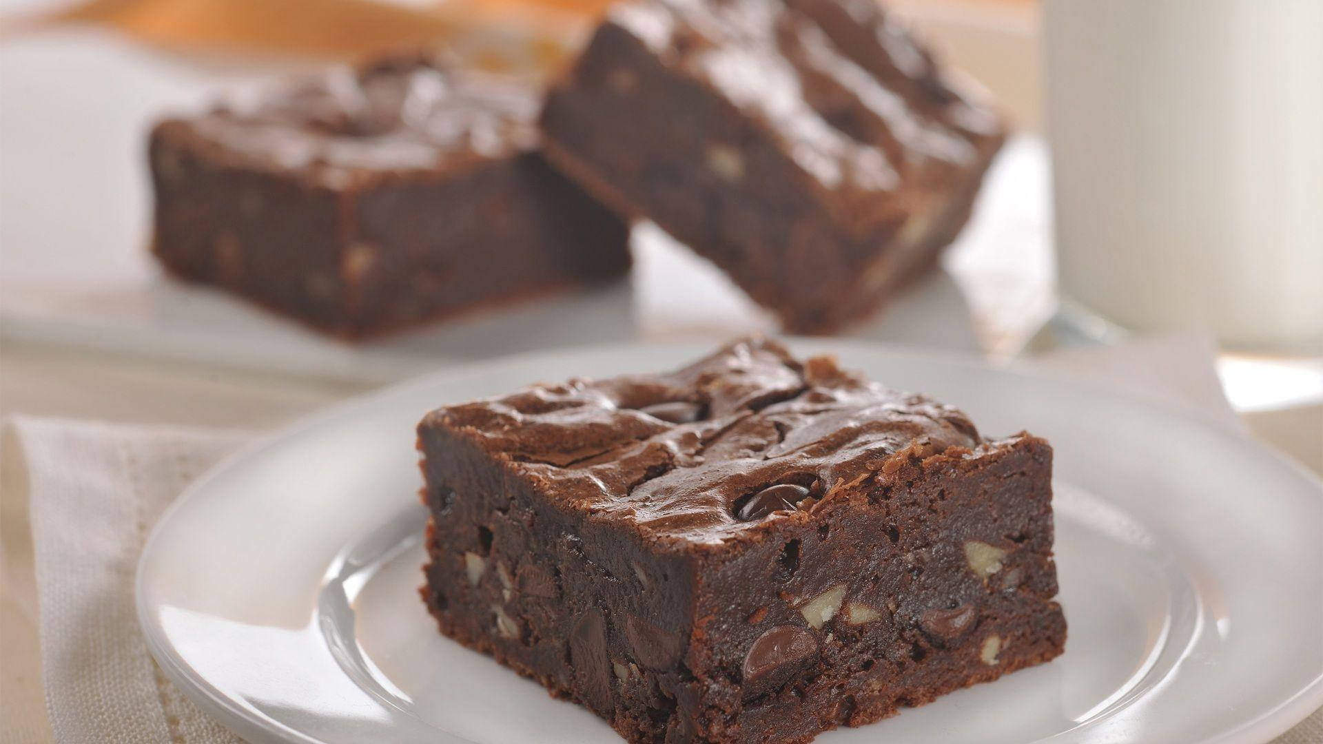 Brownies With Chocolate And Nuts Background