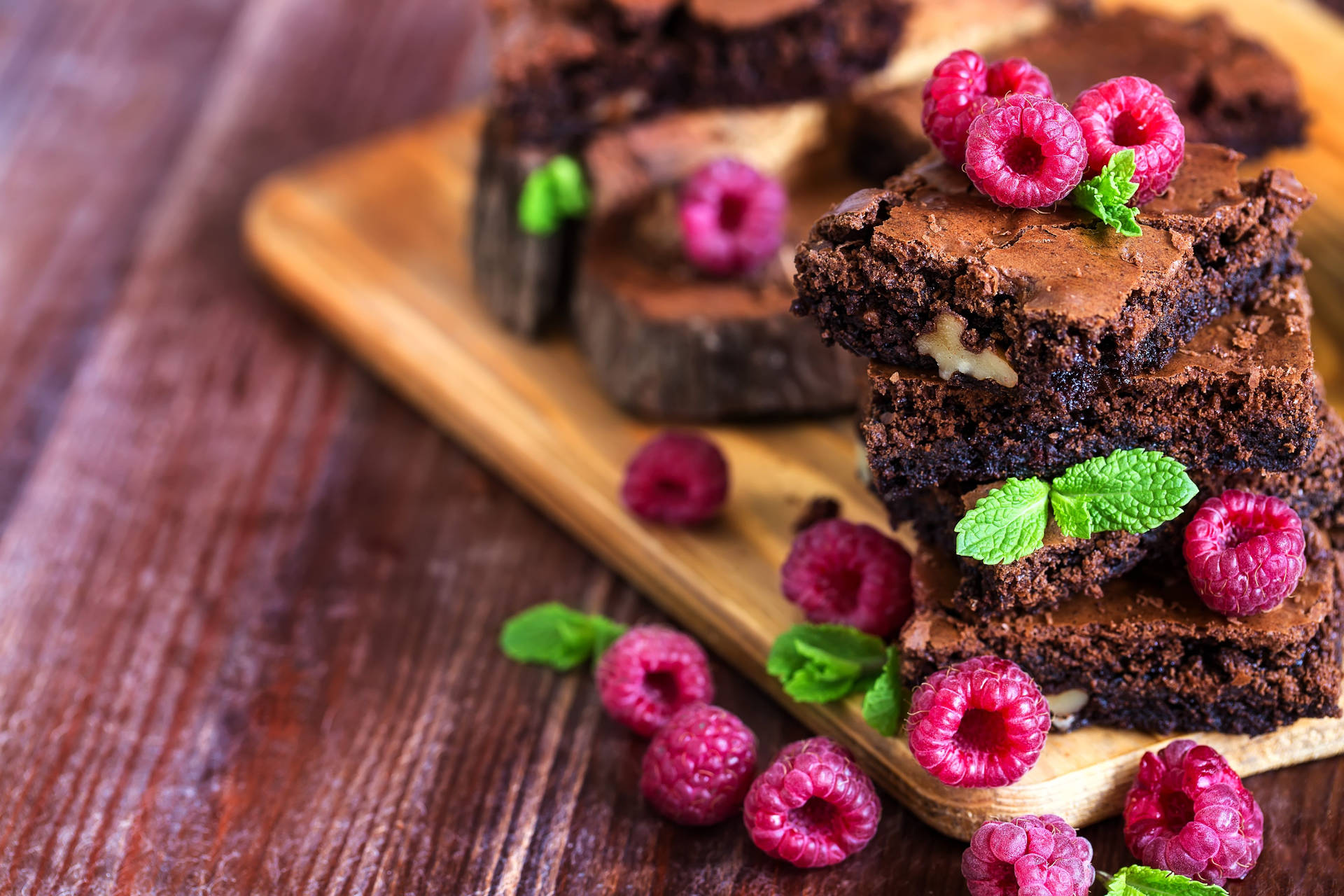 Brownies With Raspberries And Mint Background