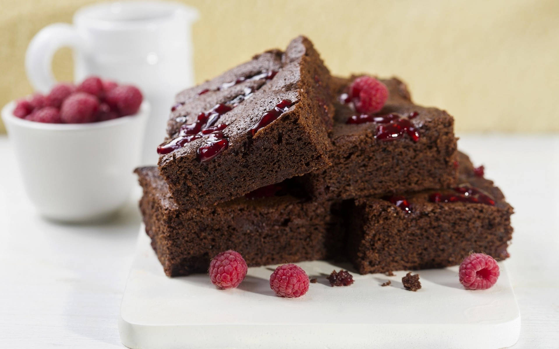 Brownies With Raspberry Background