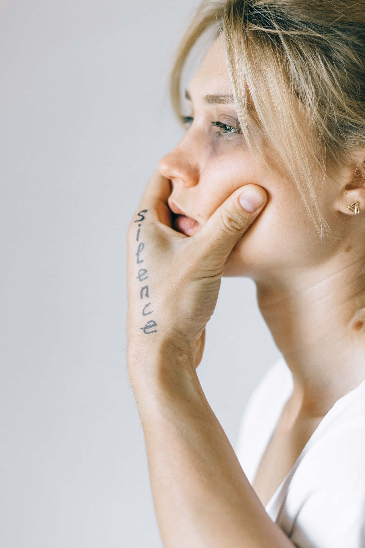 Bruised Girl Held By Hand Background