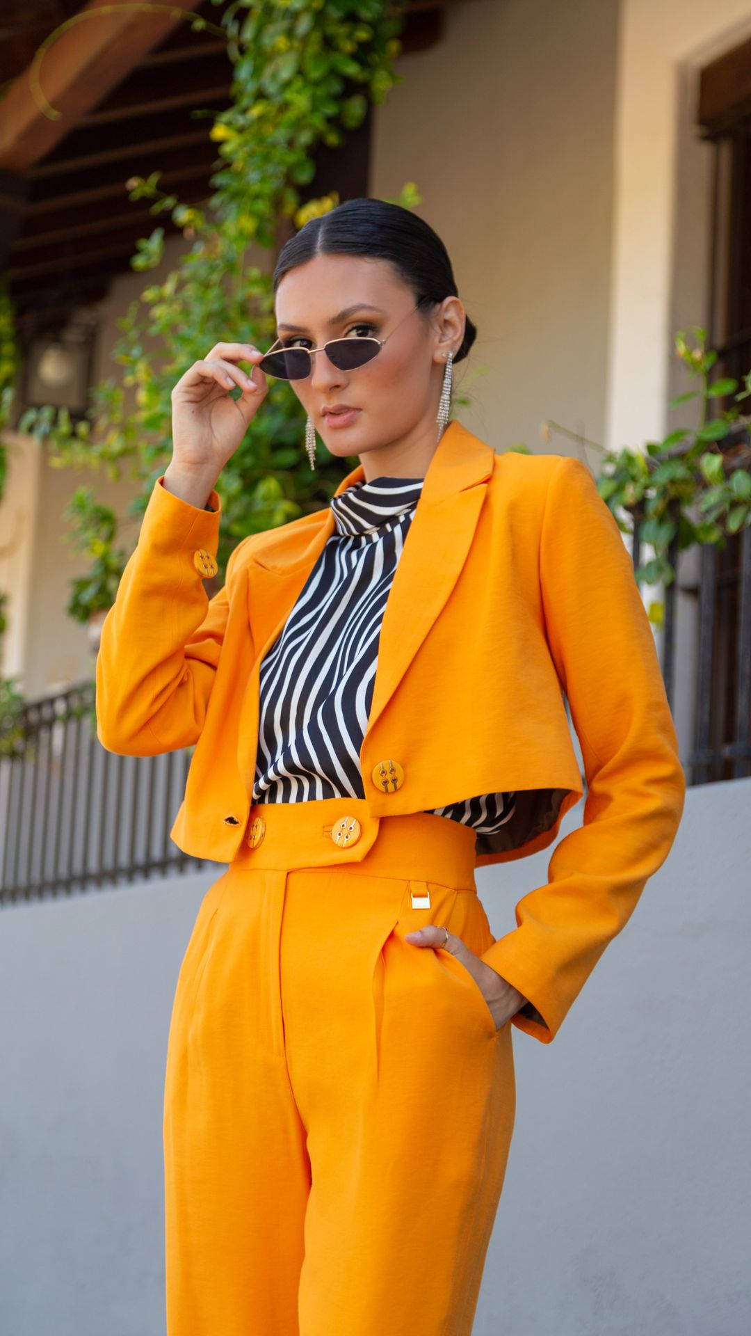 Brunette Woman Orange Suit Background