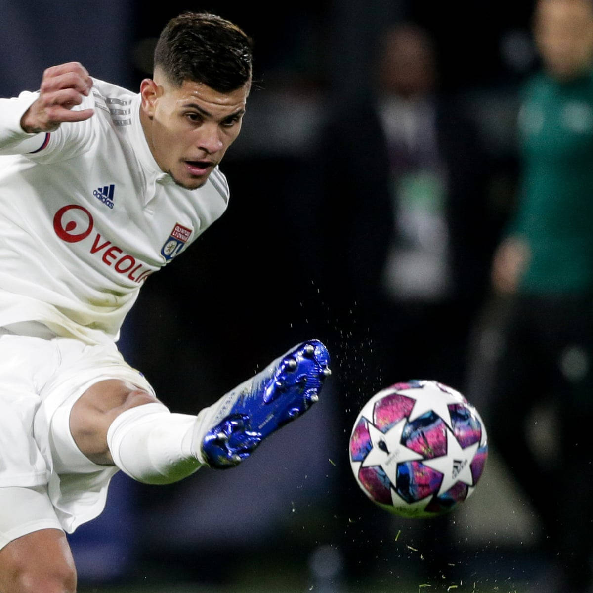 Bruno Guimaraes Delivers A Powerful Kick During A Football Match. Background