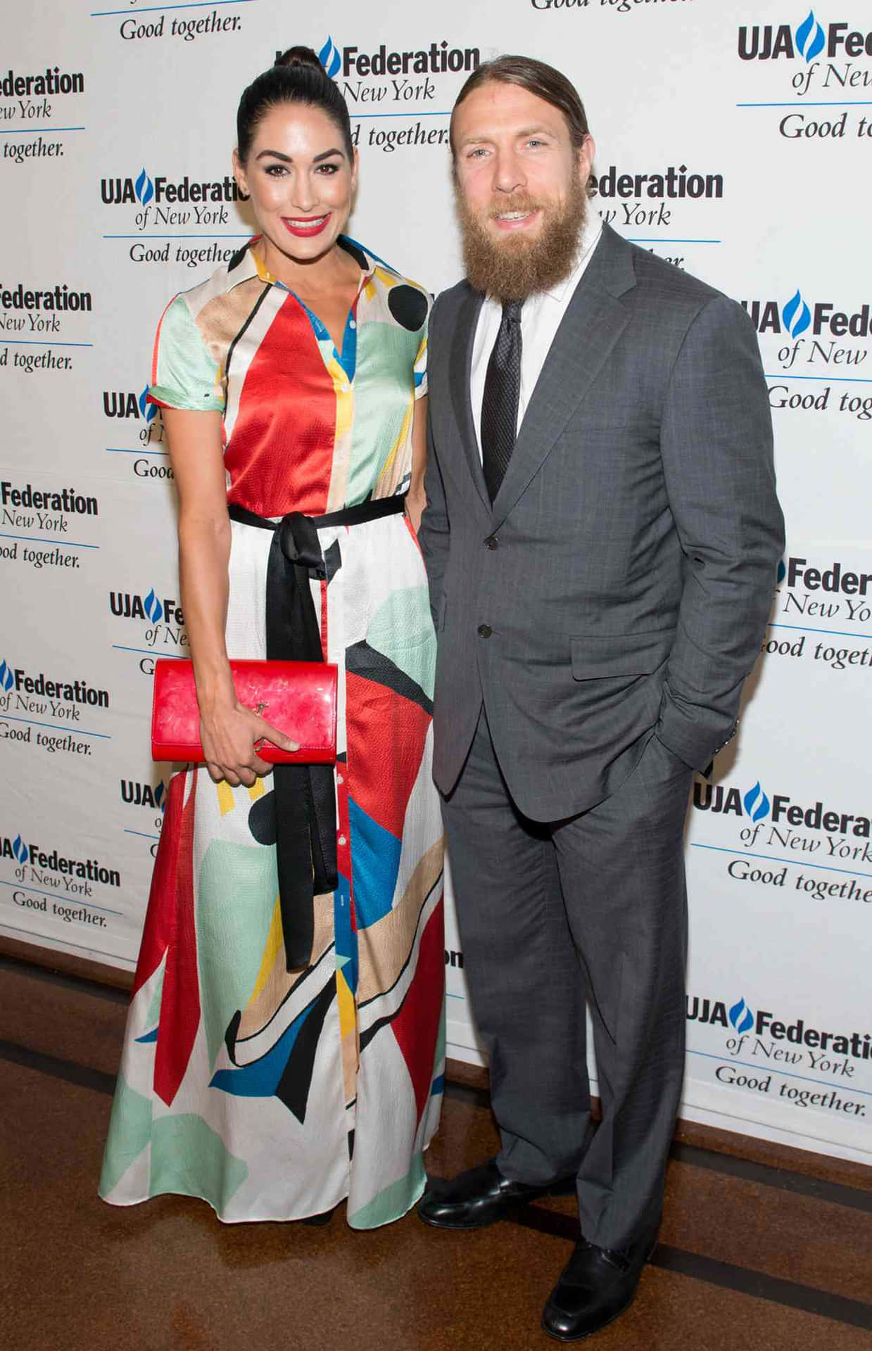 Bryan Danielson And Brie Bella Celebrating Their Love Background